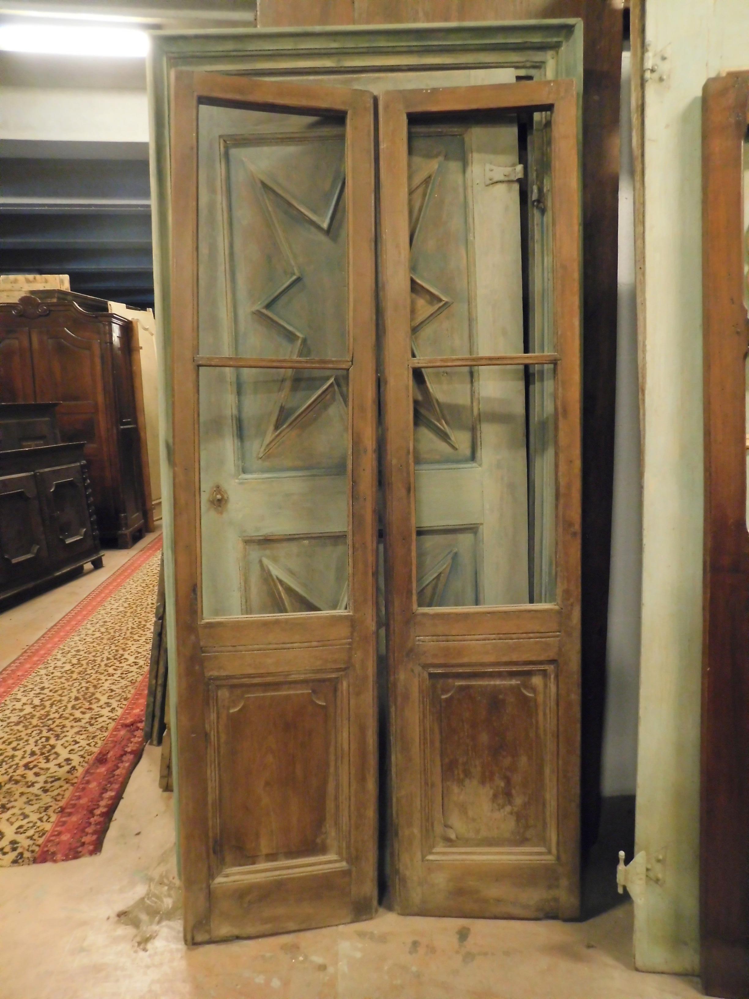 Double-leaf glass door in walnut, carved into the panel, to be restored as seen in the photo, without glass but with a lot of potential, ideal for dividing rooms and letting the light pass through the door, has original handle, built in the 19th
