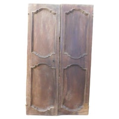 Puerta de doble hoja de nogal con paneles tallados, Italia