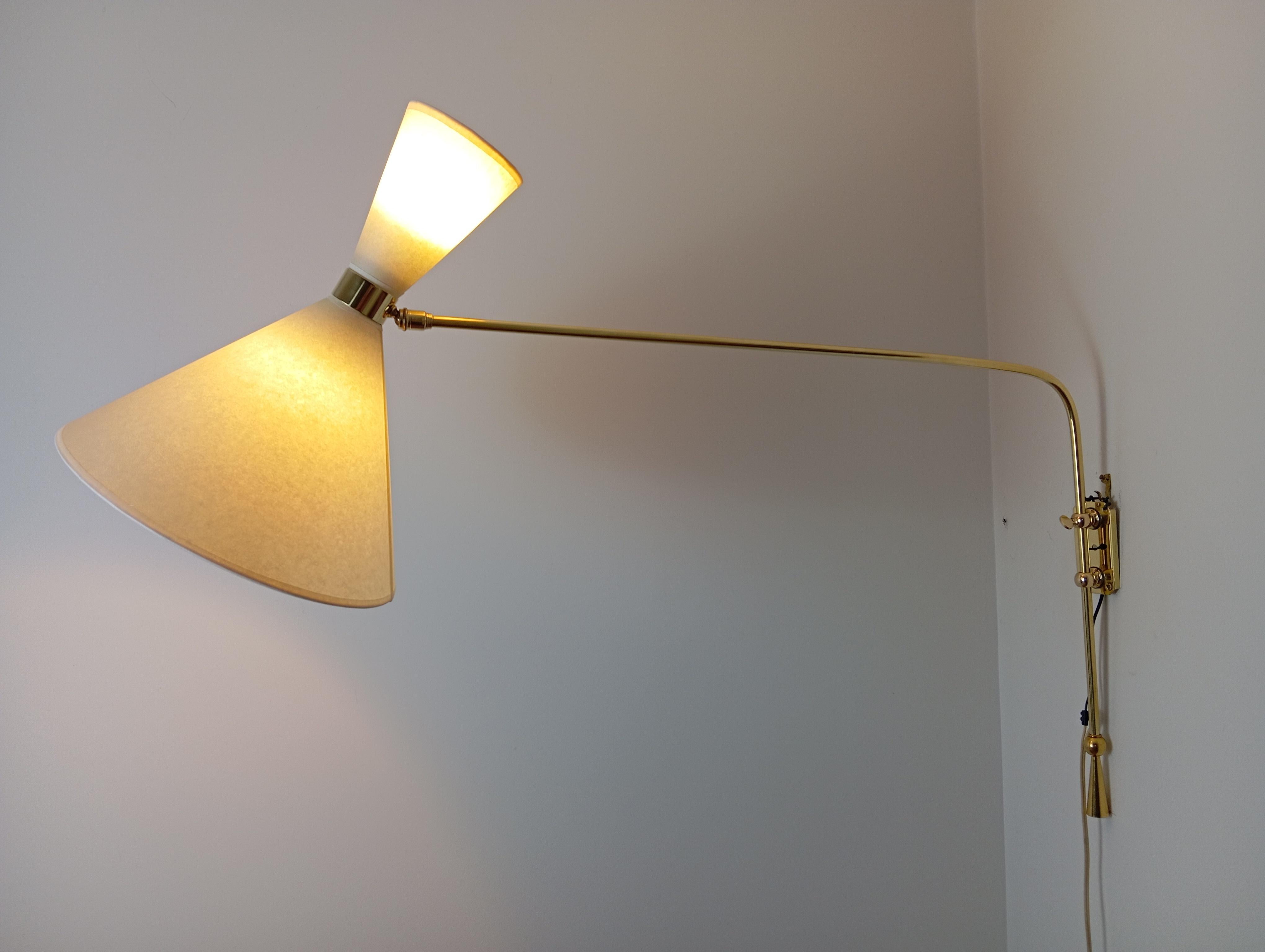 Brass Double light wall bracket, oriantable, Maison Lunel Circa 1950 For Sale