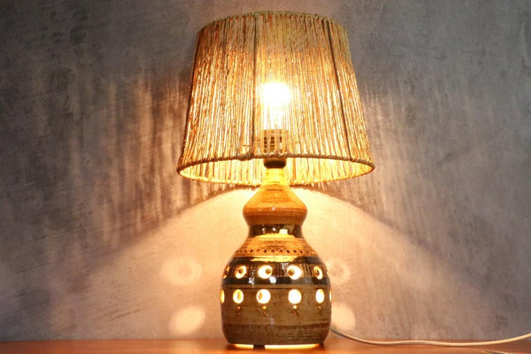 Double lighting French ceramic lamp by Georges Pelletier, 1970s

It is a large and beautiful ceramic lamp. It offers a double lighting since a second bulb is inside the lamp base. The light is very soft and allows to highlight the characteristic