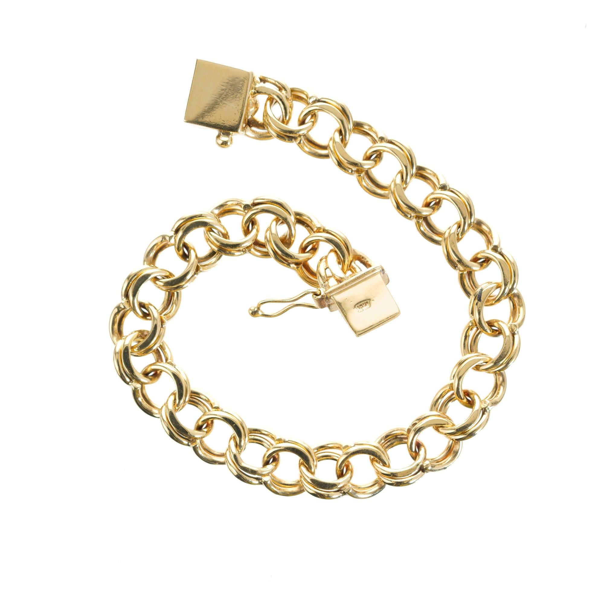14k yellow gold double line solid charm bracelet, high polished with a box clasp and figure 8.   7.25 inches in length. 

Tested: 14k
Stamped: 14k
Weight: 23.5 grams
Length: 7.25
Width: 8.89mm 
Thickness/depth: 4.3