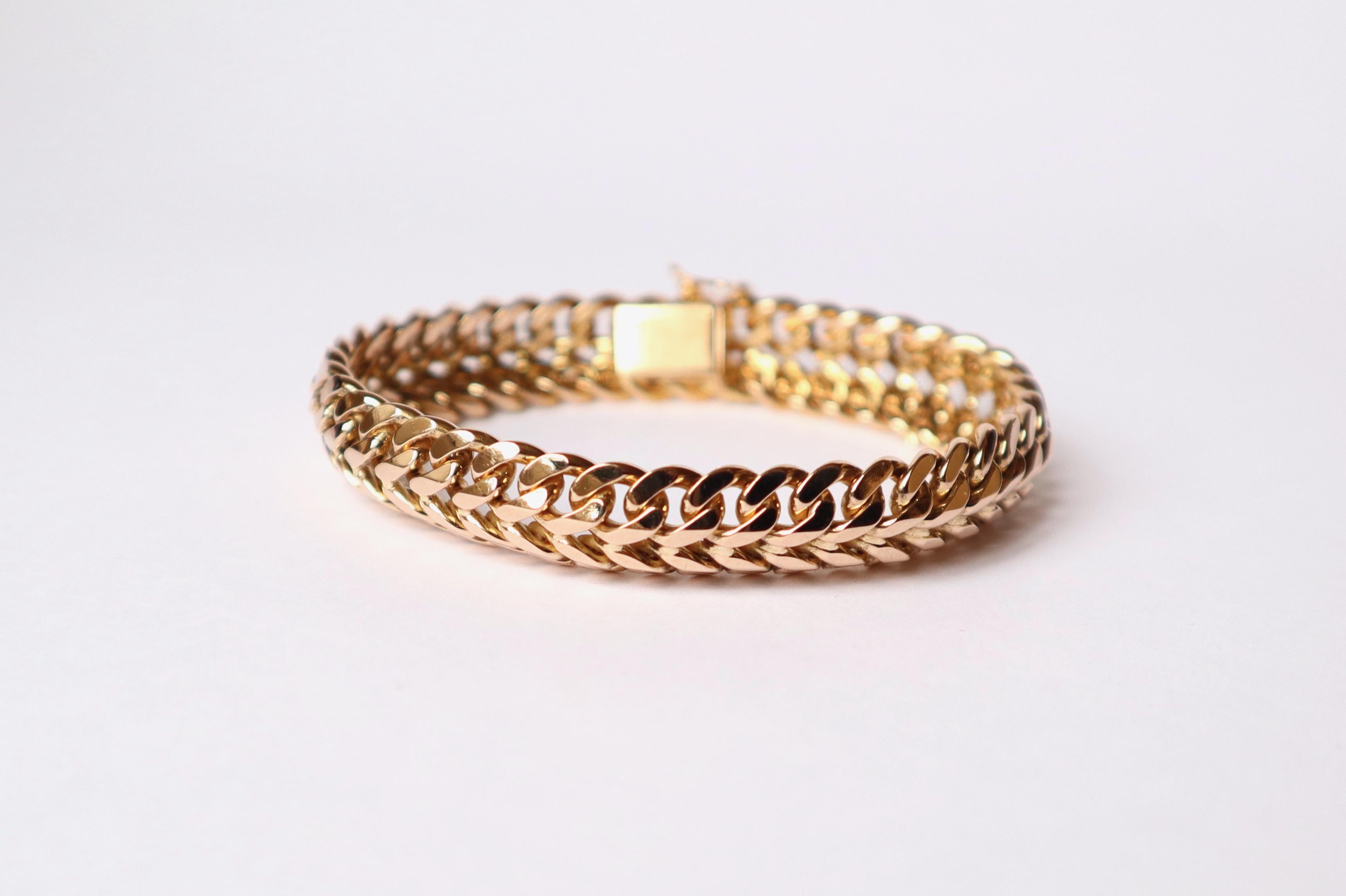 Vintage double curb link bracelet circa 1960 in 18 Kt yellow gold articulated links
Weight: 53.1g 
Length: 19cm Width: 1.2cm. 
Eagle head hallmark.