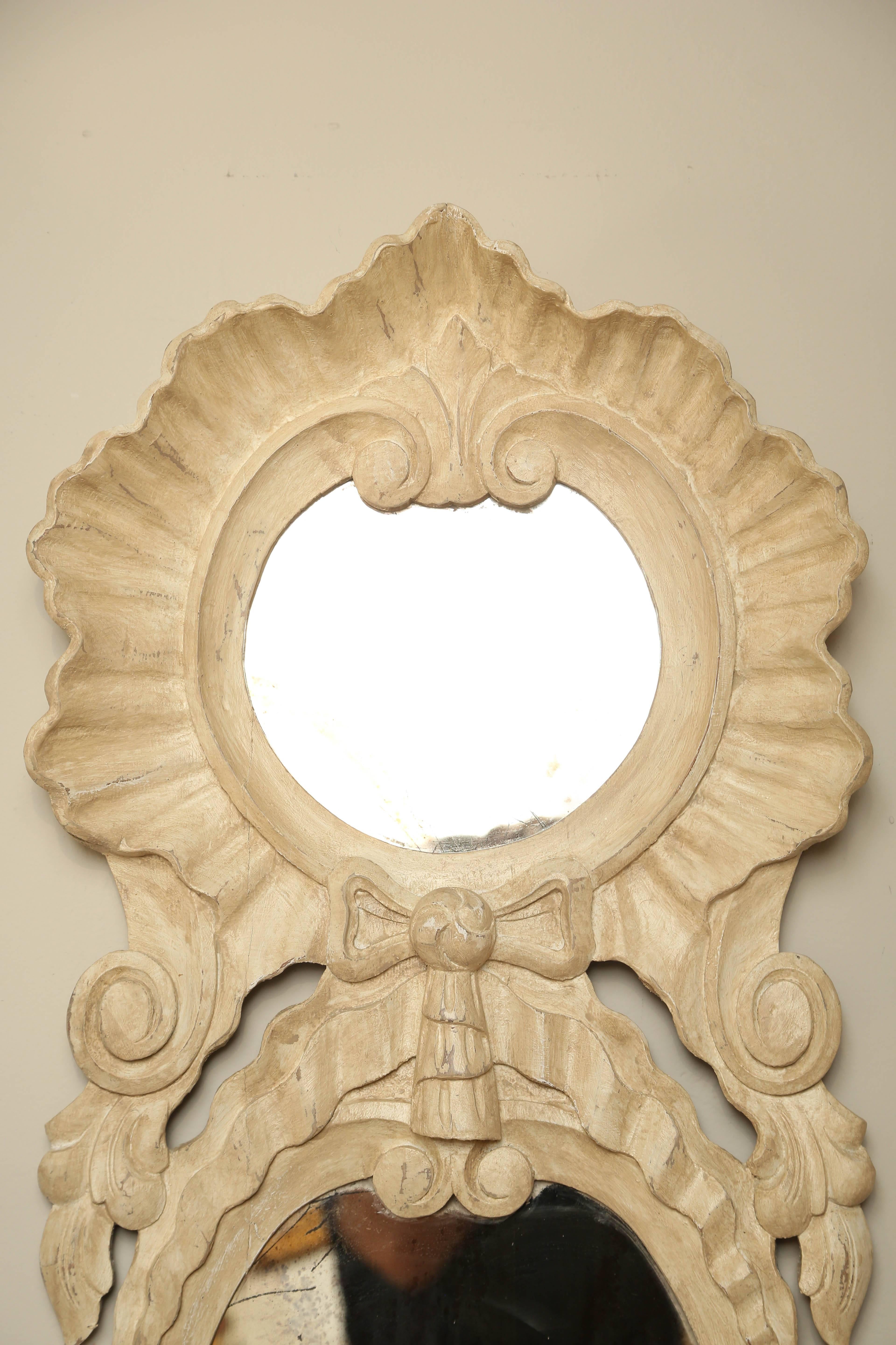 Carved and painted wall pocket with two mirrors.