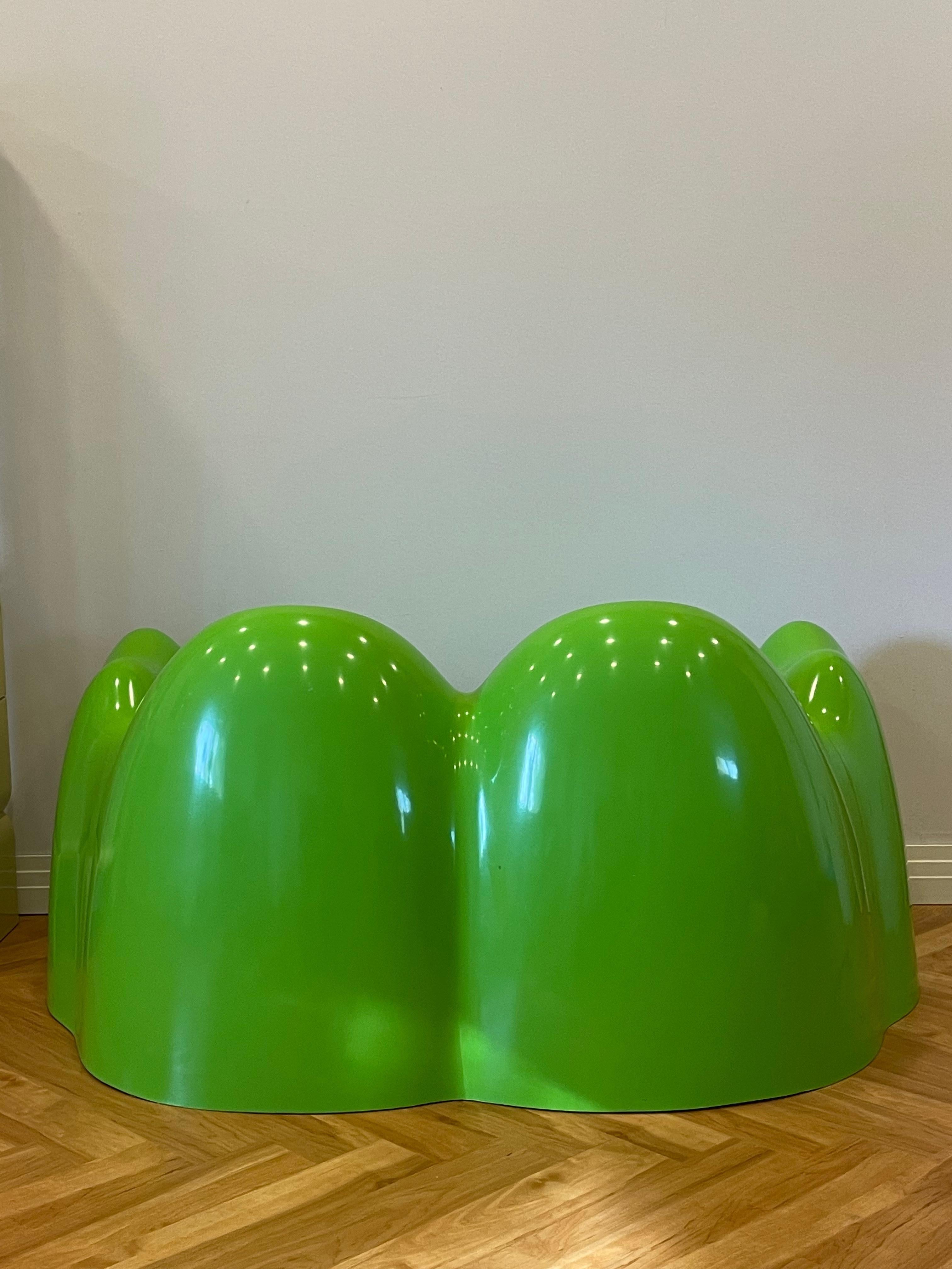 Double Molar settee in rare and vibrant green. Made of fiberglass. Missing rubber lining.