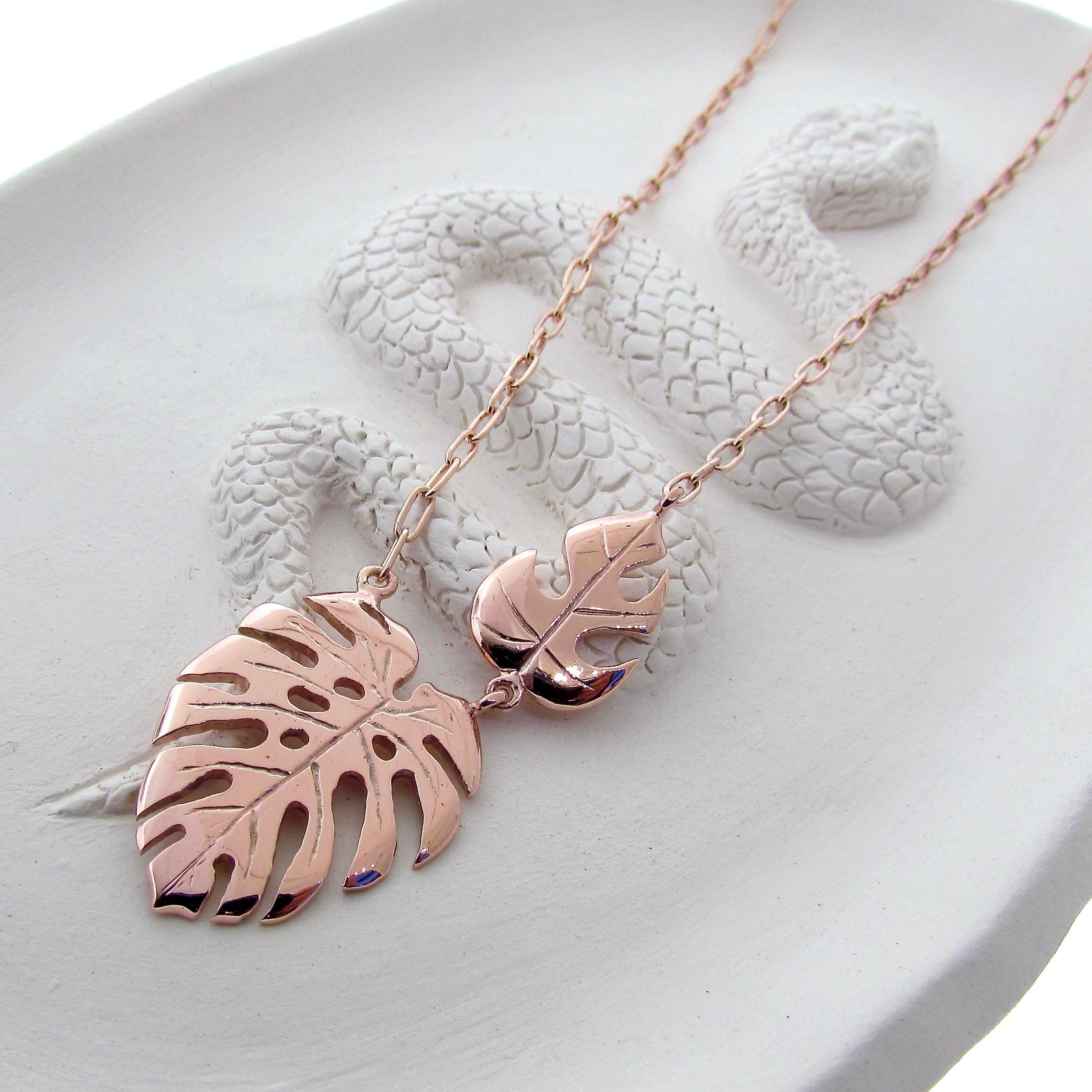 Solid 9K Rose Gold Large and Mini Monstera Leaf Necklace

Large Leaf Pendant length is 3.1cm 
weight 10grams 
Total Length is 45cm
please get in touch for a quote on a custom length 

A talisman symbolic of honour, respect and longevity
a beautiful