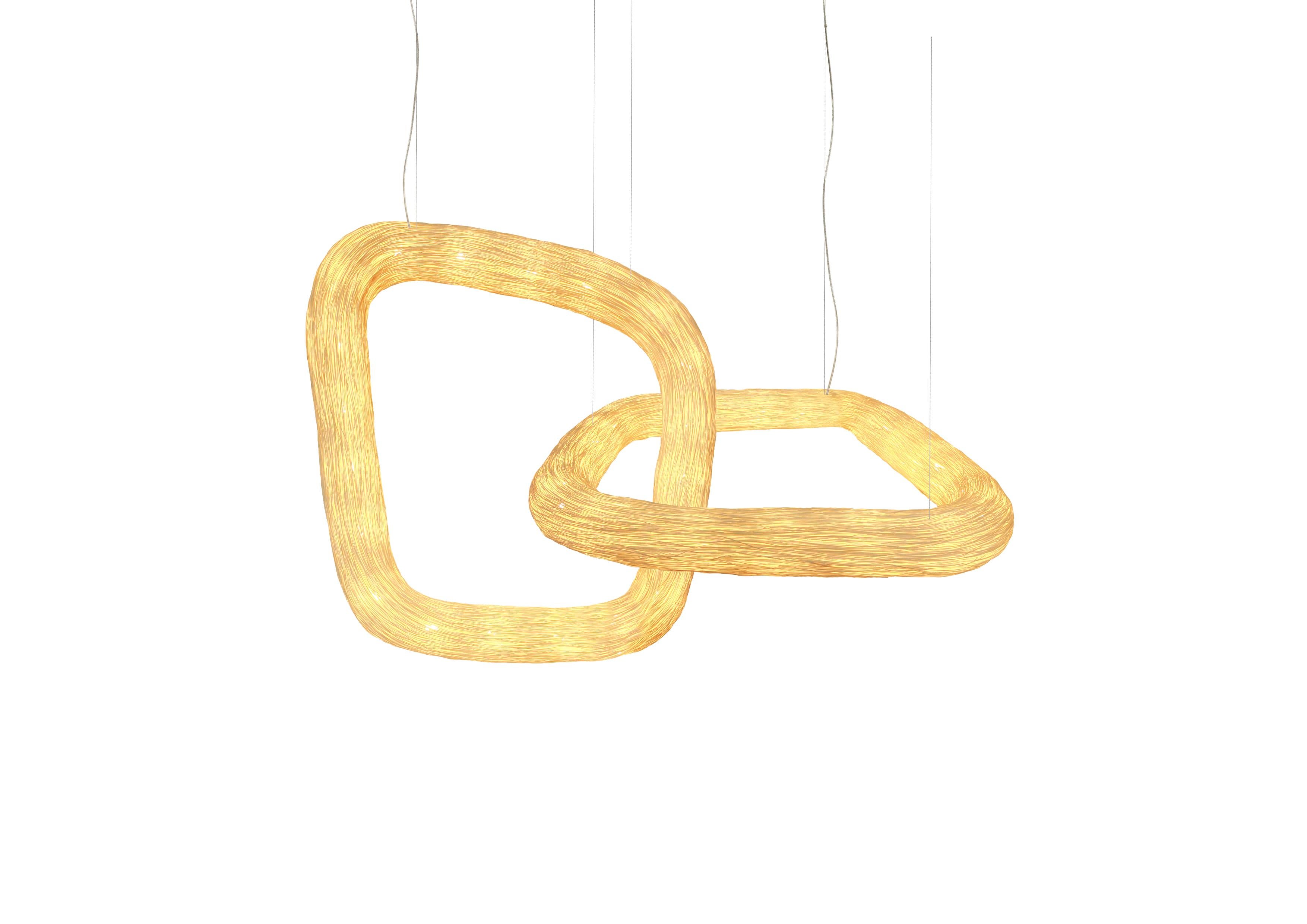 Double Orbit is a unique architectonic rattan ceiling light that is part of the Ango continuity series, where two handcrafted interlocking organic light ring forms reference a double infinity ring and the eternal bond this represents. Multiple