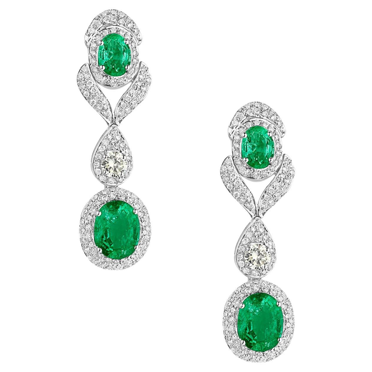 Double Oval Shaped Emerald Earrings with VS Diamonds Made in 14k White Gold For Sale