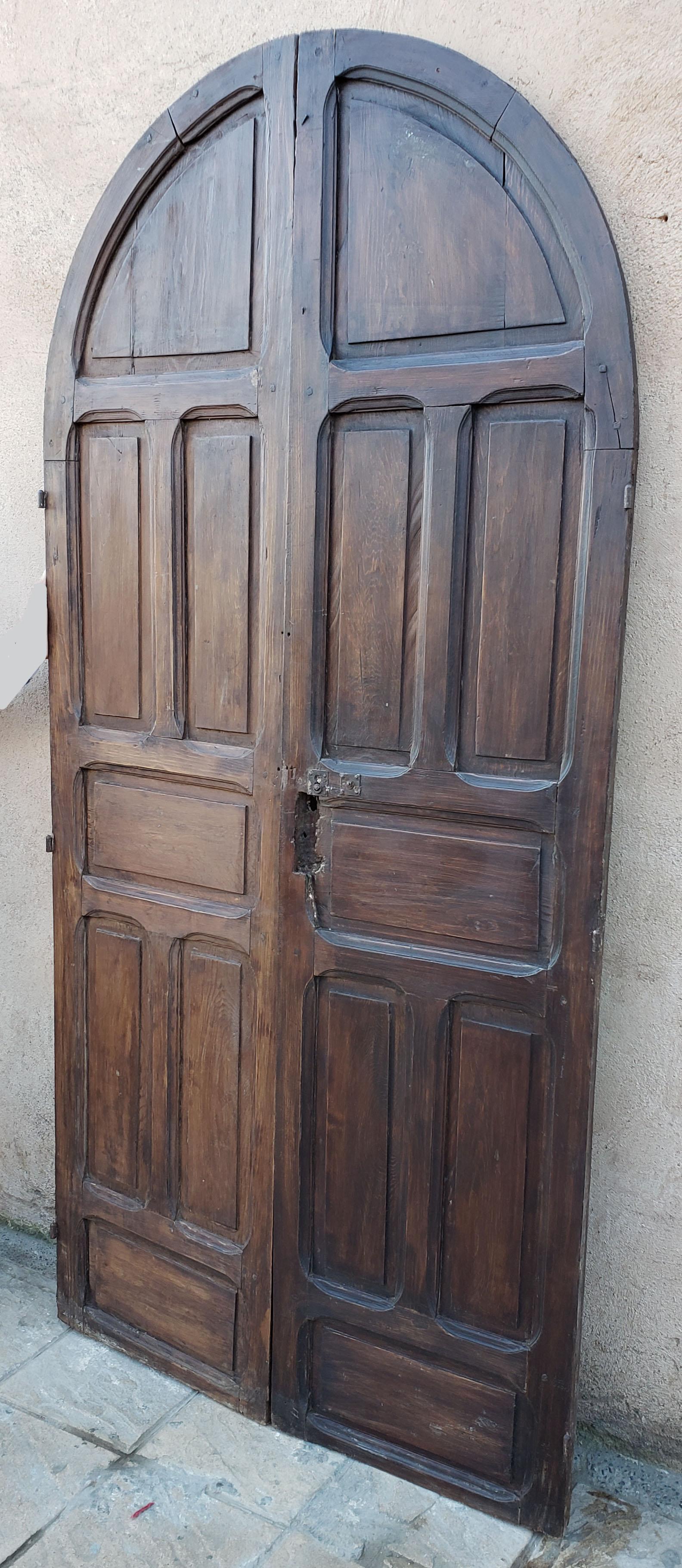 Early 20th Century Double Panel Arched Moroccan Wooden Door, 23ND34 For Sale