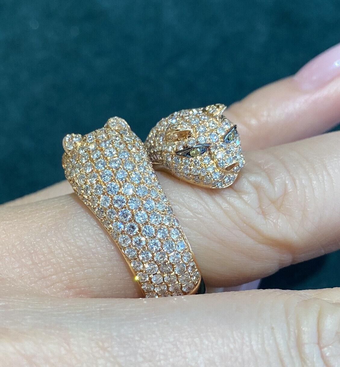 Double Panther Head Diamond Wrap Ring 3.70 carat total weight in 18k Rose Gold

Double Panther Head Diamond Ring features two Panther Heads wrapping around the finger, adorned with 3.70 carats of Round Brilliant Diamonds, pave-set, and 2 Yellow