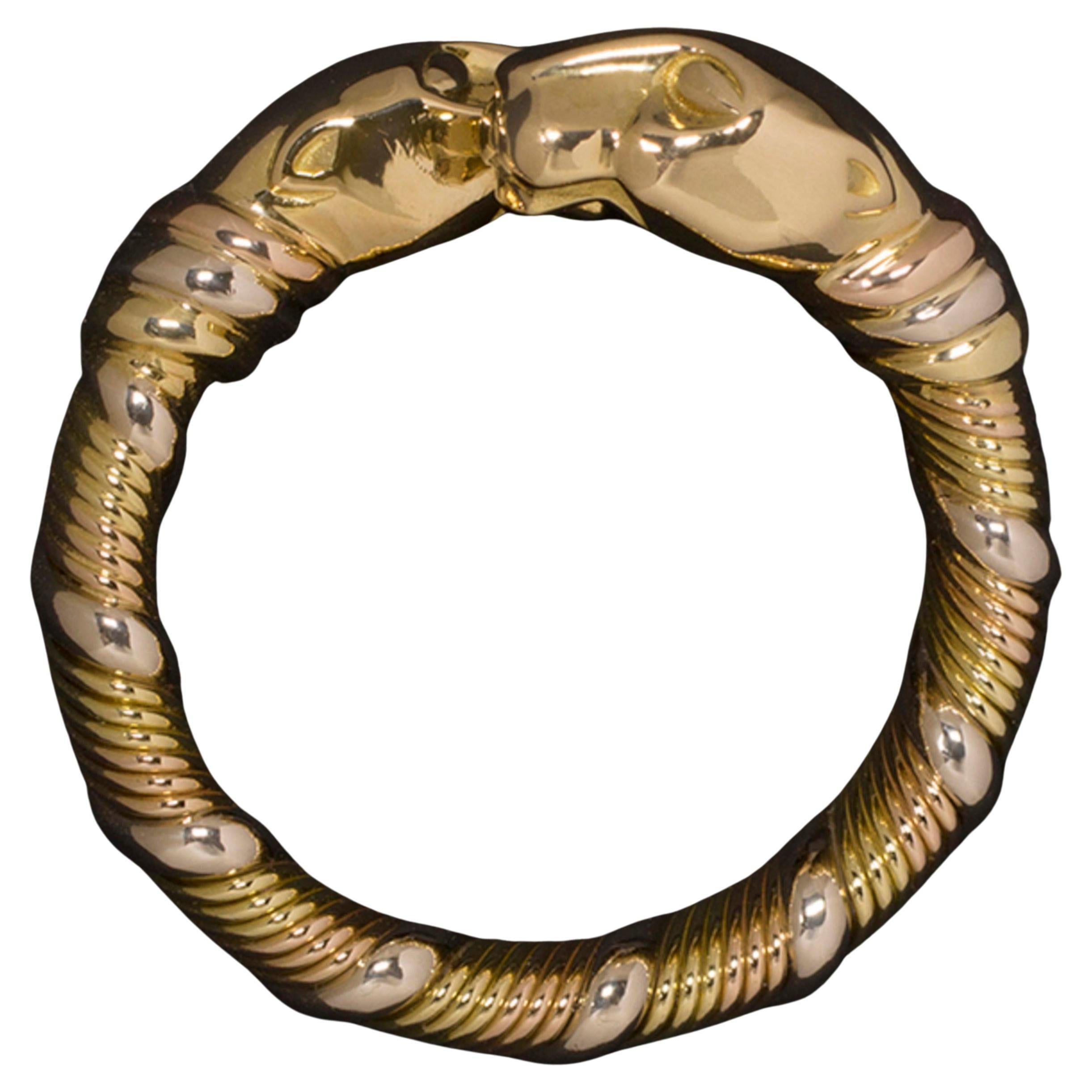 Authentic Cartier Panthère Ring, made in 18k yellow, white, and rose gold.
The weight of this ring is 10.90 grams
The size is 5.75 US, at customer's request we can resize in 3 days.