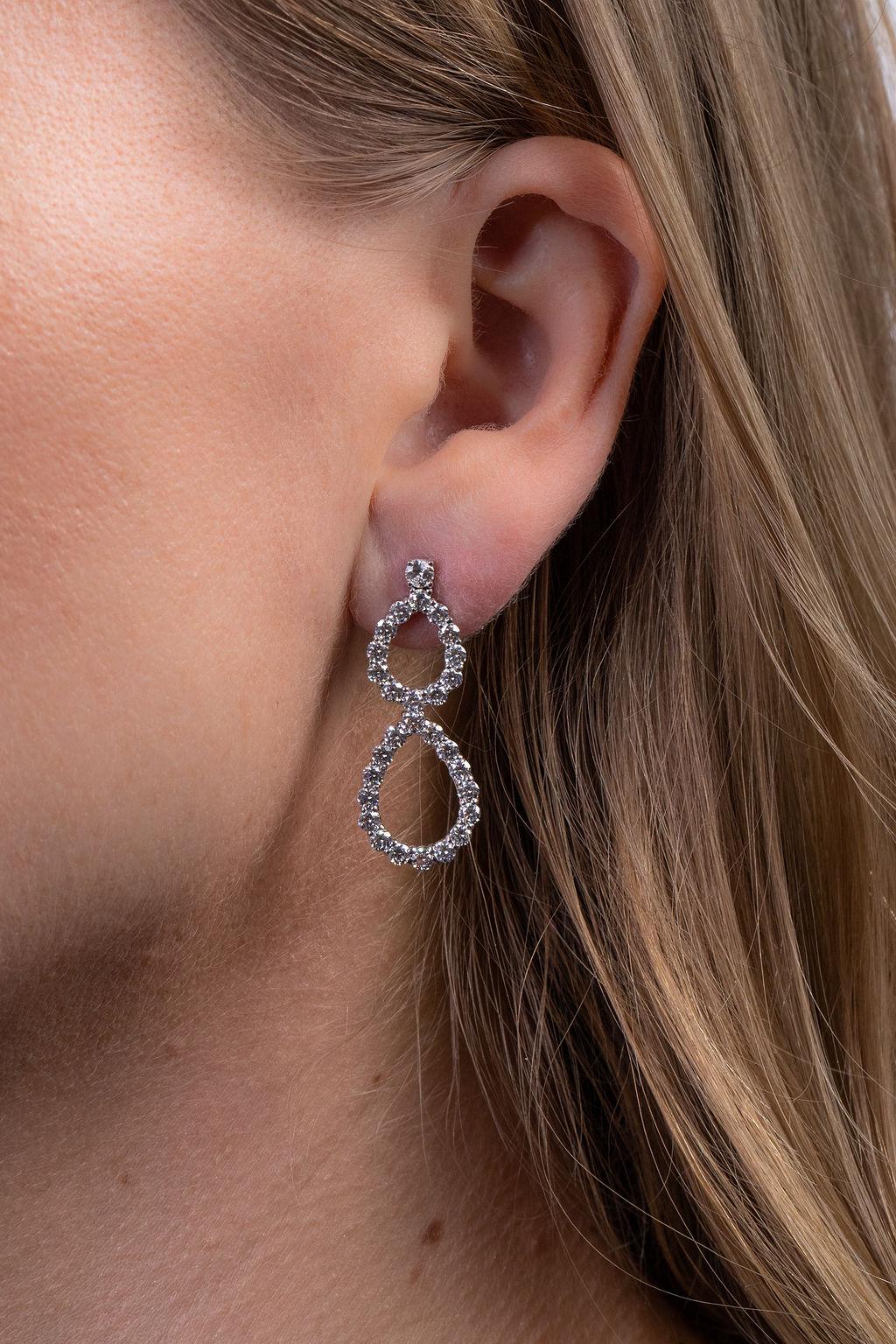 These beautiful double pear drops move effortlessly from daytime to evening.  Made in 18k white gold, each earring measures 1 ½ inches in length.  (Approx. 3.25 tcw).