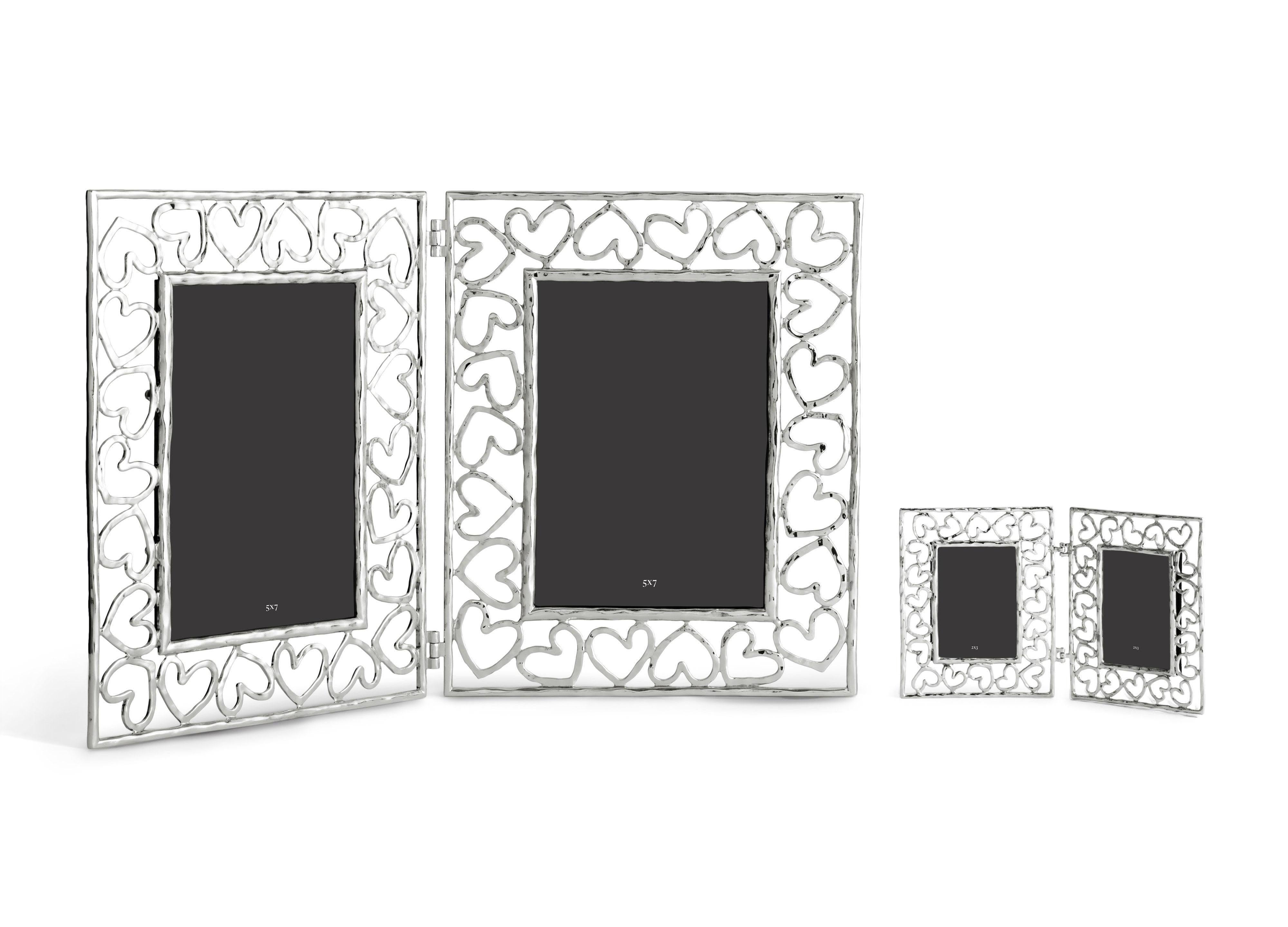 Double photo frame with heart design, silver metal, large model.

Show off your photos with this double hinged heart-shaped photo frame in silver metal. The Heart collection is based on the simple yet universal symbol of love, hope, friendship and