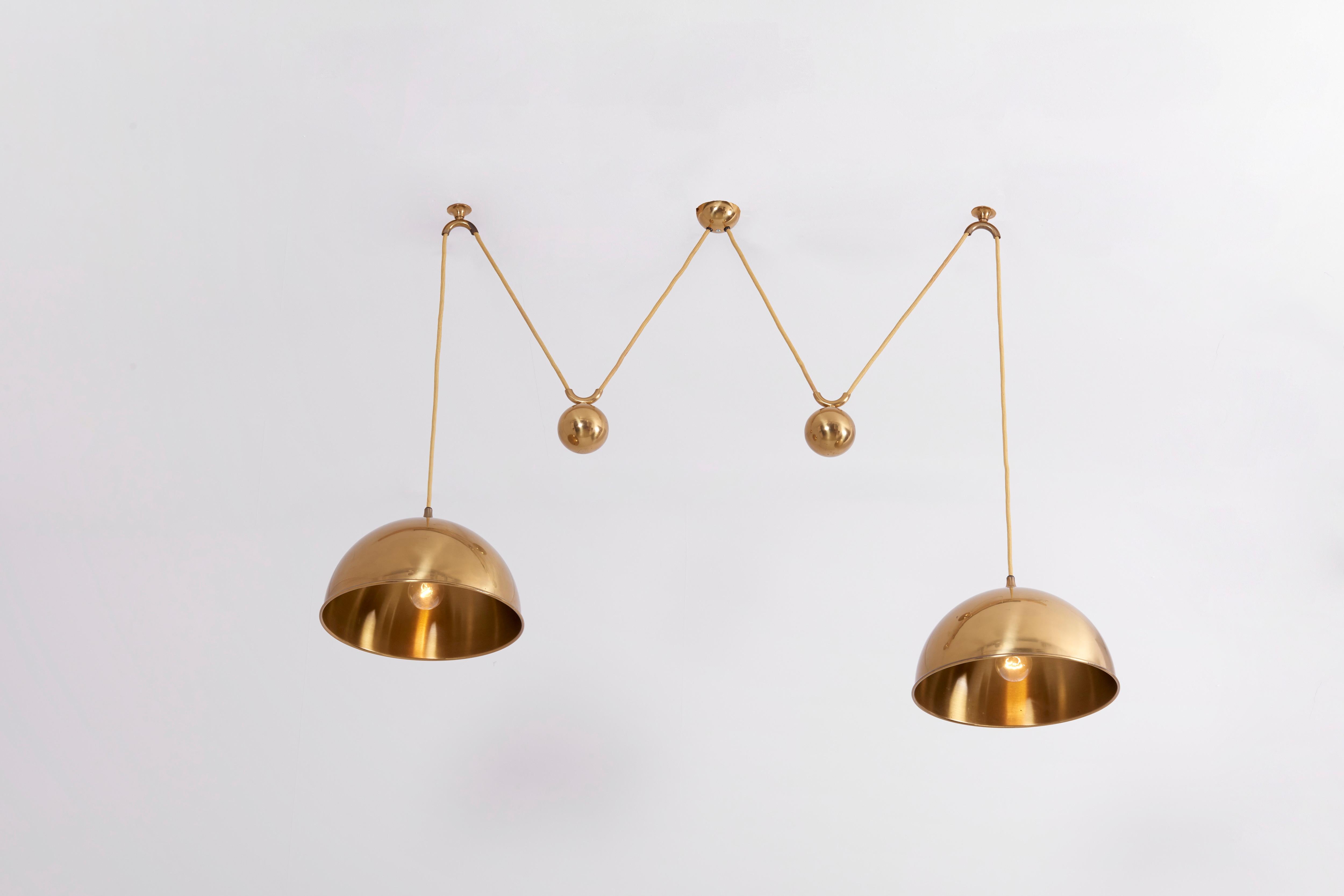 Beautiful Florian Schulz Double Posa pendant lamp in brass.

1 x E27 socket / each lamp shade.

Please note: Lamp should be fitted professionally in accordance to local requirements.