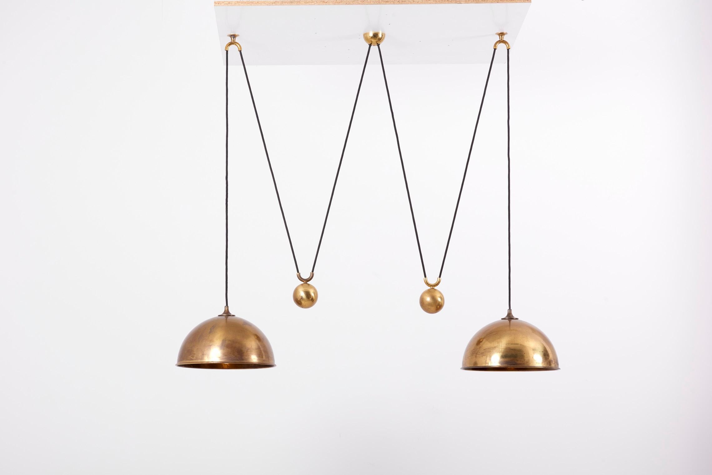 Beautiful Florian Schulz double Posa pendant lamp in brass.

1 x E27 socket / each lamp shade.

Please note: Lamp should be fitted professionally in accordance to local requirements.