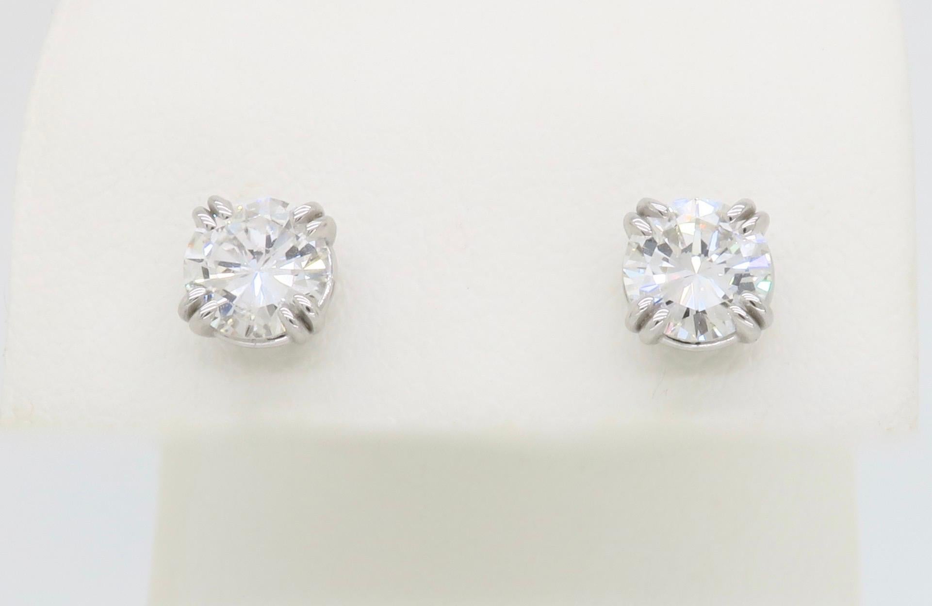 Classic Earth Mined Diamond earrings set into double prong studs. 

Total Diamond Carat Weight: 1.40CTW
Diamond Cut: Round Brilliant Cut 
Diamond Color: G-H
Diamond Clarity: VS2-SI1
Metal: 14k White Gold
Stamped: 
