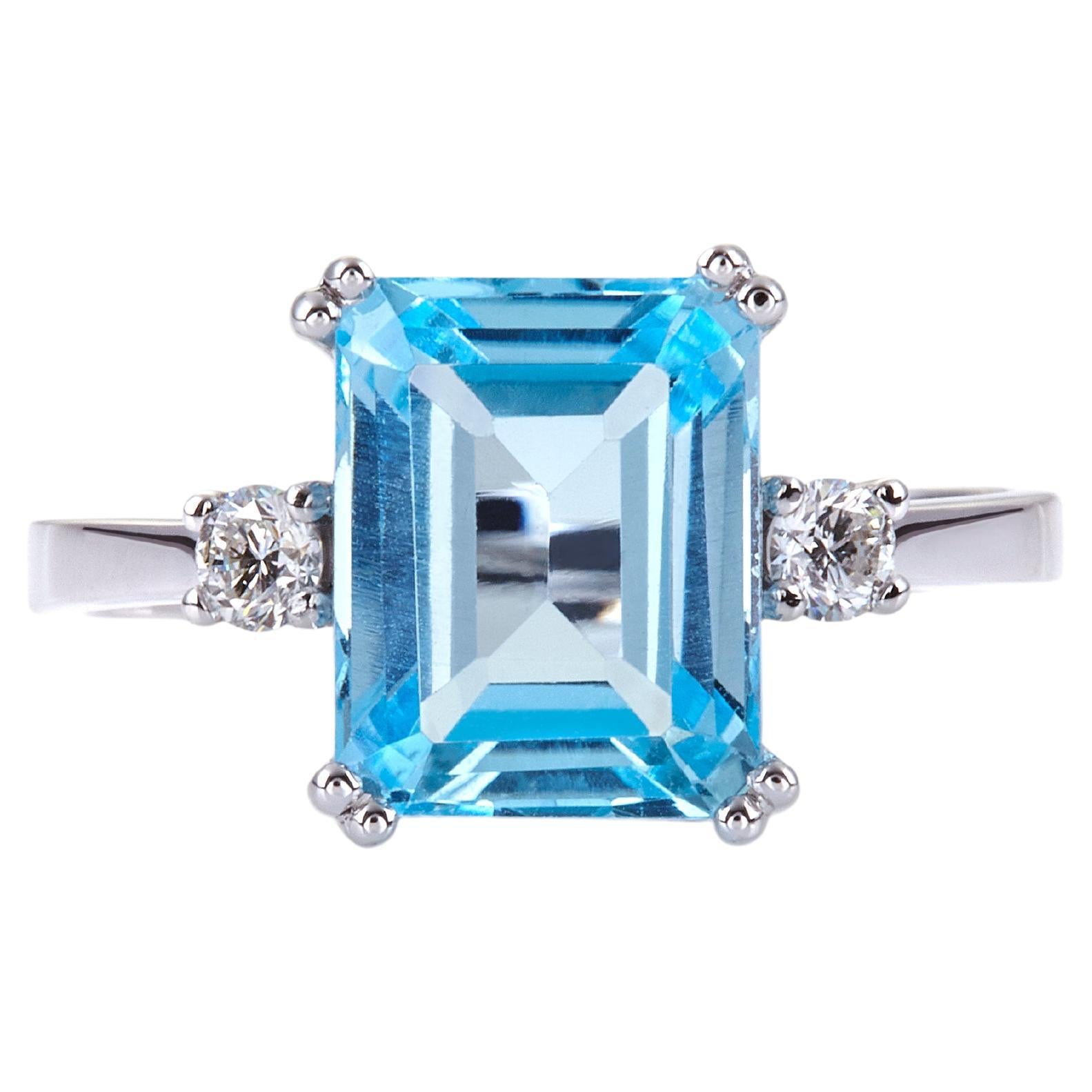 For Sale:  Double Prong Ring in 18Kt White Gold with Emerald Cut Blue Topaz and Diamonds