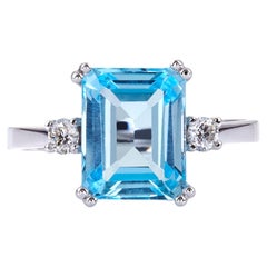Double Prong Ring in 18Kt White Gold with Emerald Cut Blue Topaz and Diamonds