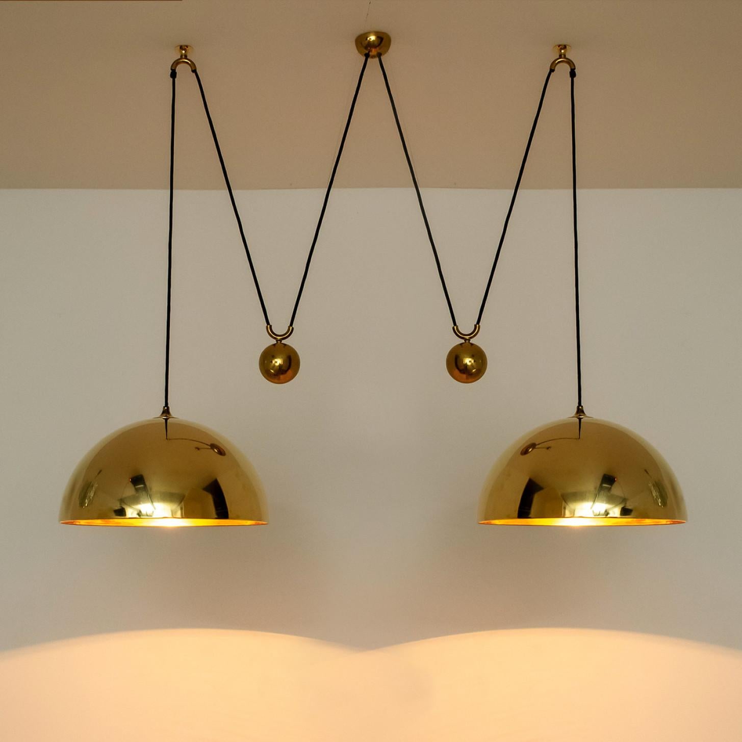 Polished Double Pull Brass Pendant Light by Florian Schulz For Sale
