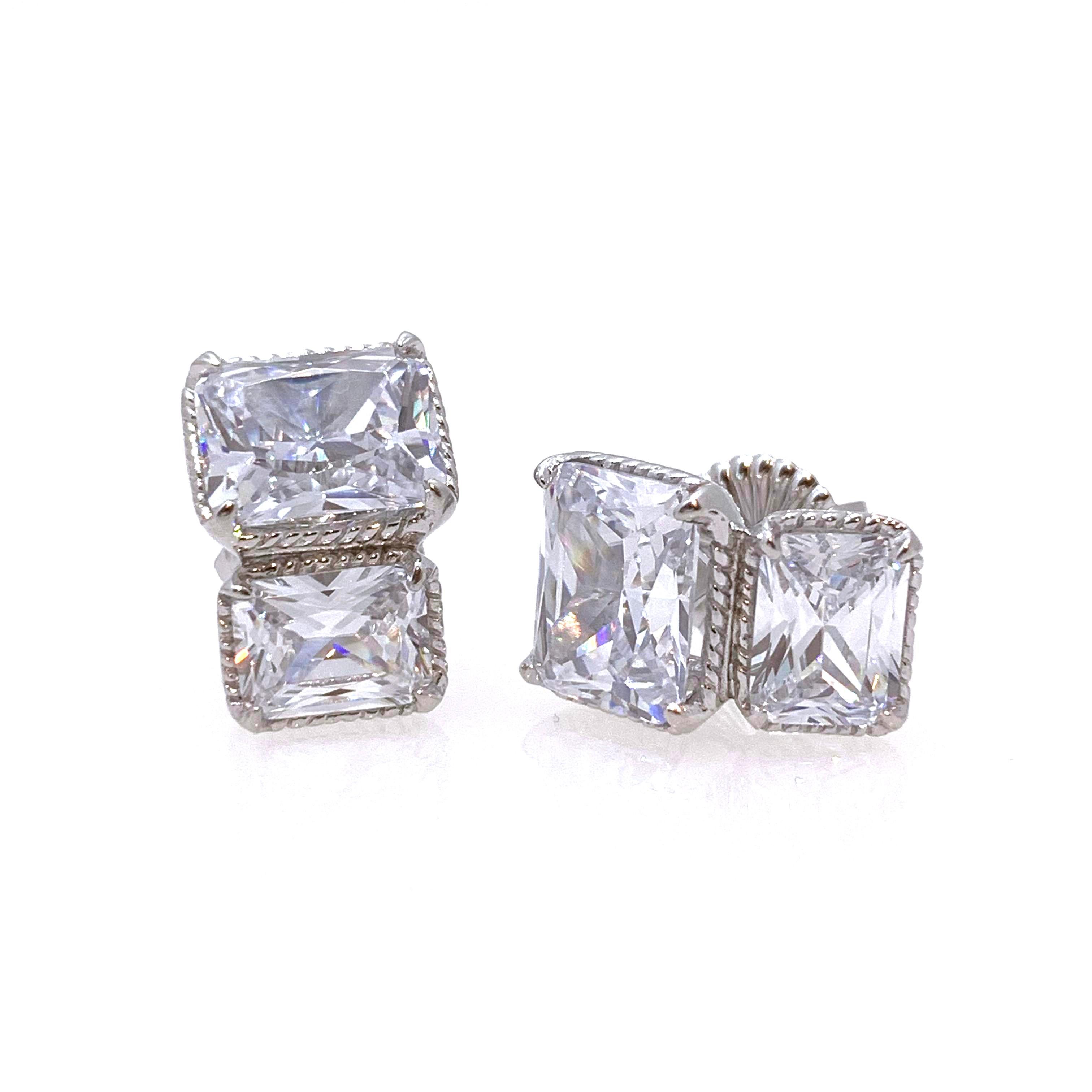 Stunning Double Radiant-cut Simulated Diamond Stud Sterling Silver Earrings

These elegant earrings feature four beautiful pieces of 3- and 2-carat radiant-cut simulated diamond cz (10 carat size total) handset in platinum rhodium plated sterling