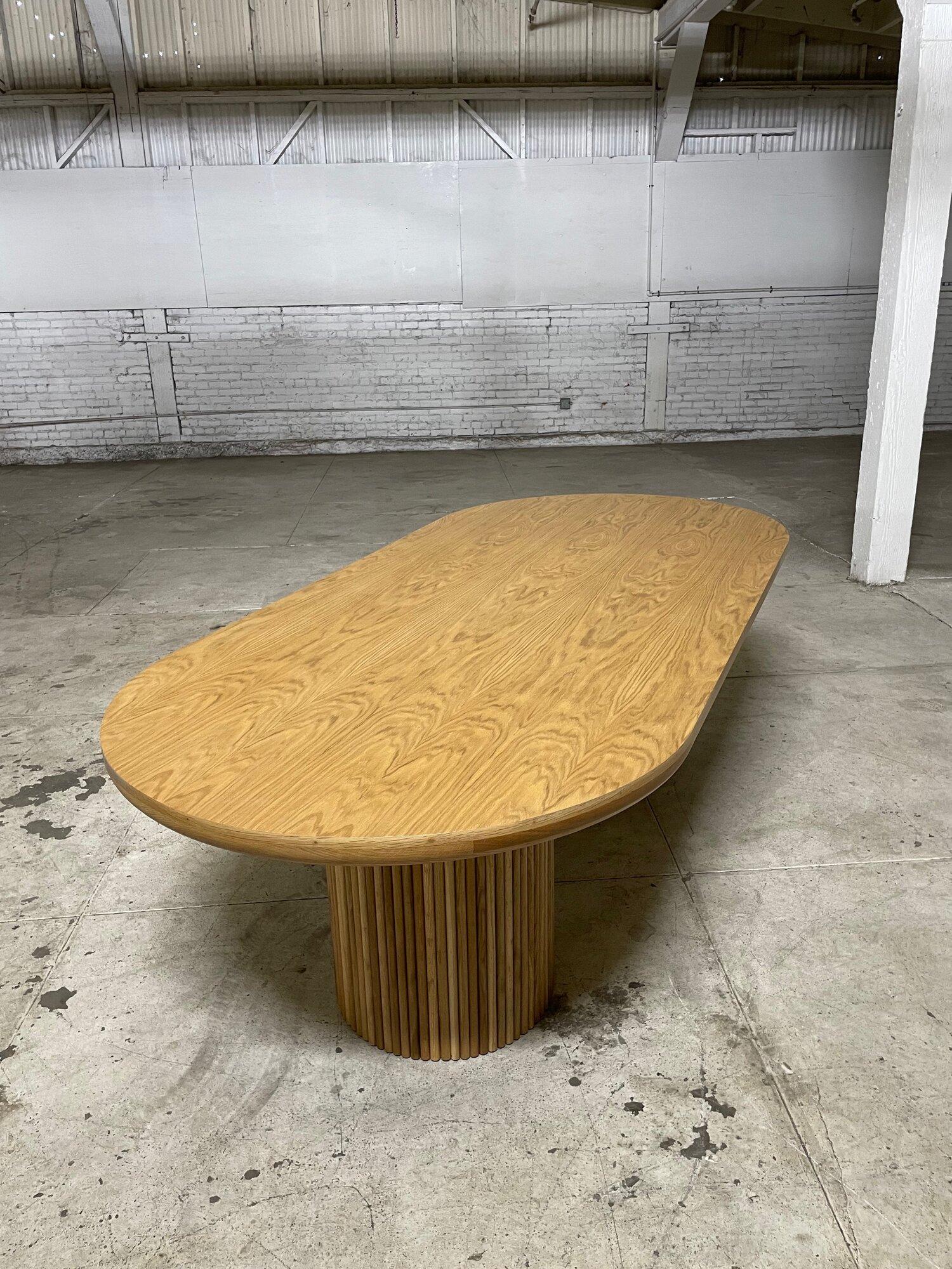 W97 D44.5 H31 Knee Clearance 28.5

Fully custom made rift white oak dining table with a race track table top that flows along the edge. The grain along the top is spectacular, since these are organic cuts of wood and each table is made upon order