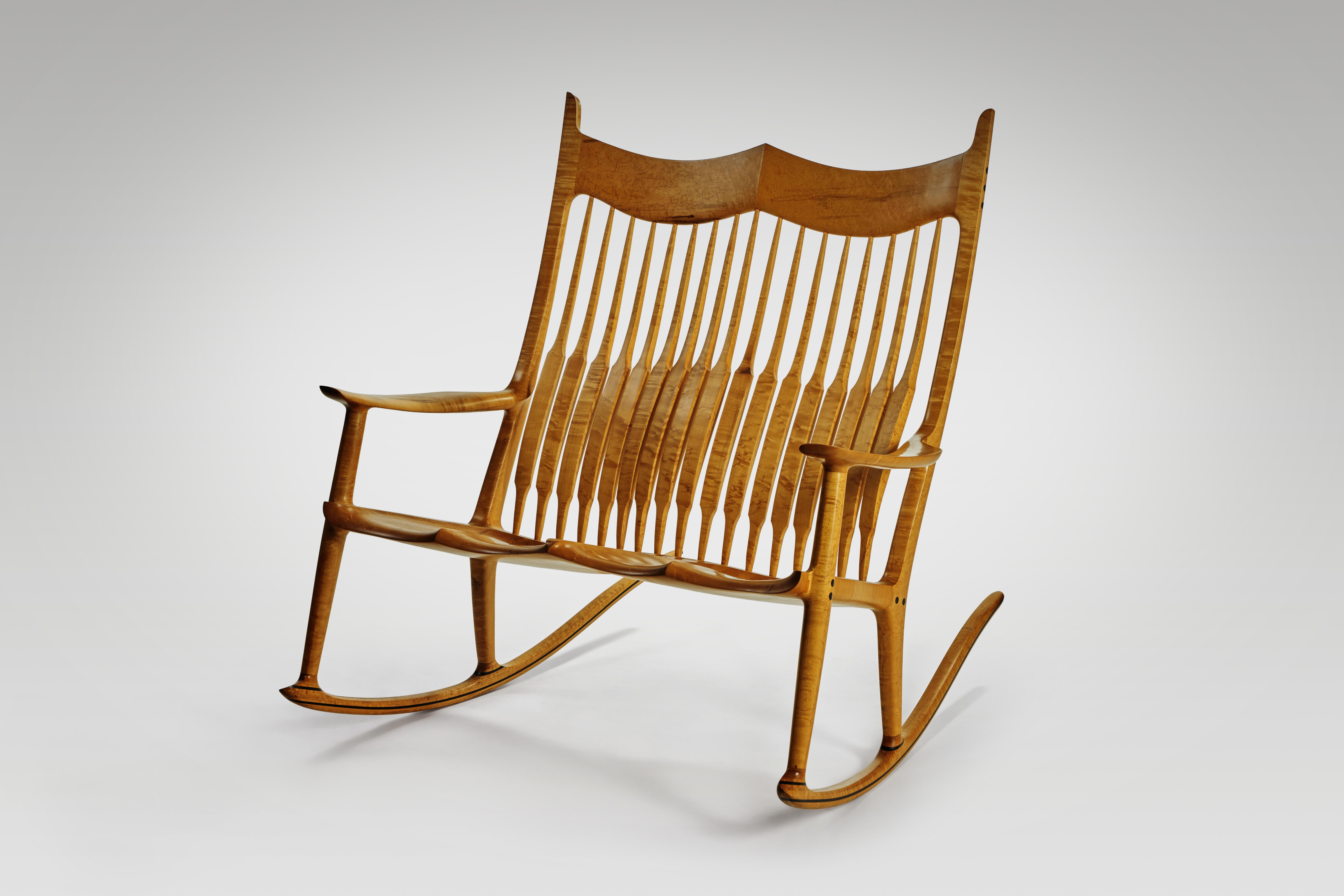 Double rocking chair by Sam Maloof, circa 1980's
signed Sam Maloof f.A.C.C./©, dated 1988 and numbered No. 9.

Literature
Jo Lauria, Craft in America: Celebrating Two Centuries of Artists and Objects, New York, 2007, p. 101 (for a related