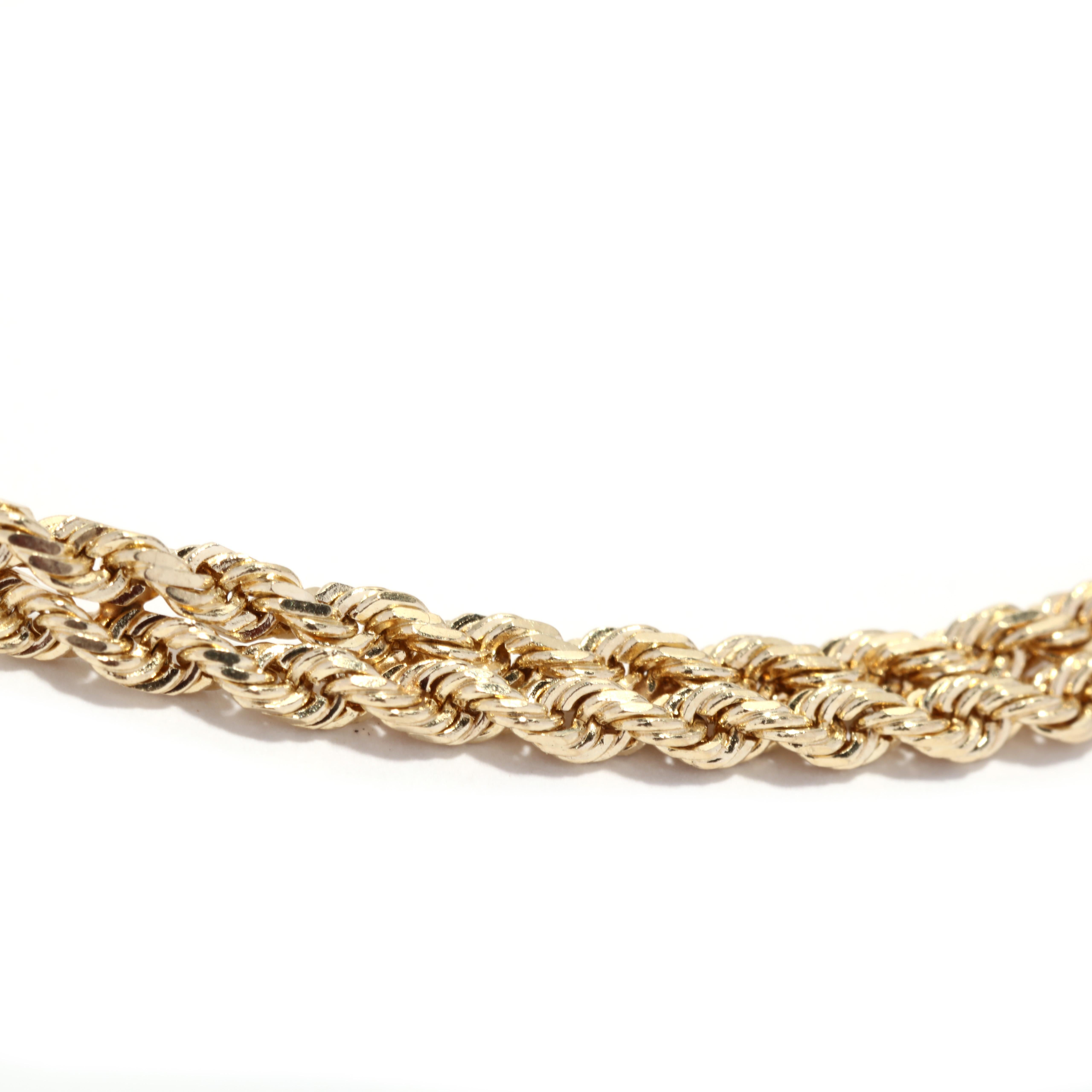 A vintage 14 karat yellow gold double rope chain bracelet. This stackable bracelet features two rows of rope twist chain with a box closure and figure eight closure.

Length: 7 in.

Width: 3.85 mm

Weight: 4.2 dwts. / 6.7 grams

Stamps: 14K

Ring