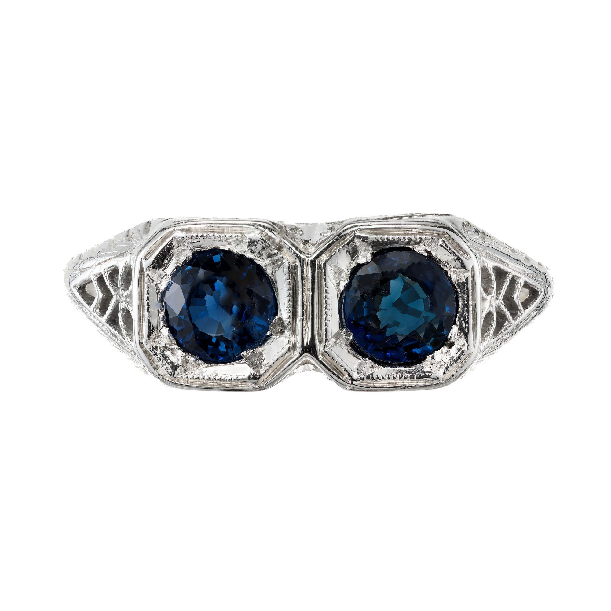 2 round blue sapphire engagement ring. Handmade 14k white gold 1940’s Art Deco filigree setting. The octagonal setting has a blue genuine European cut round sapphire.

2 round sapphires approx. total weight .90cts
Size 7 ½ and sizable
14k White