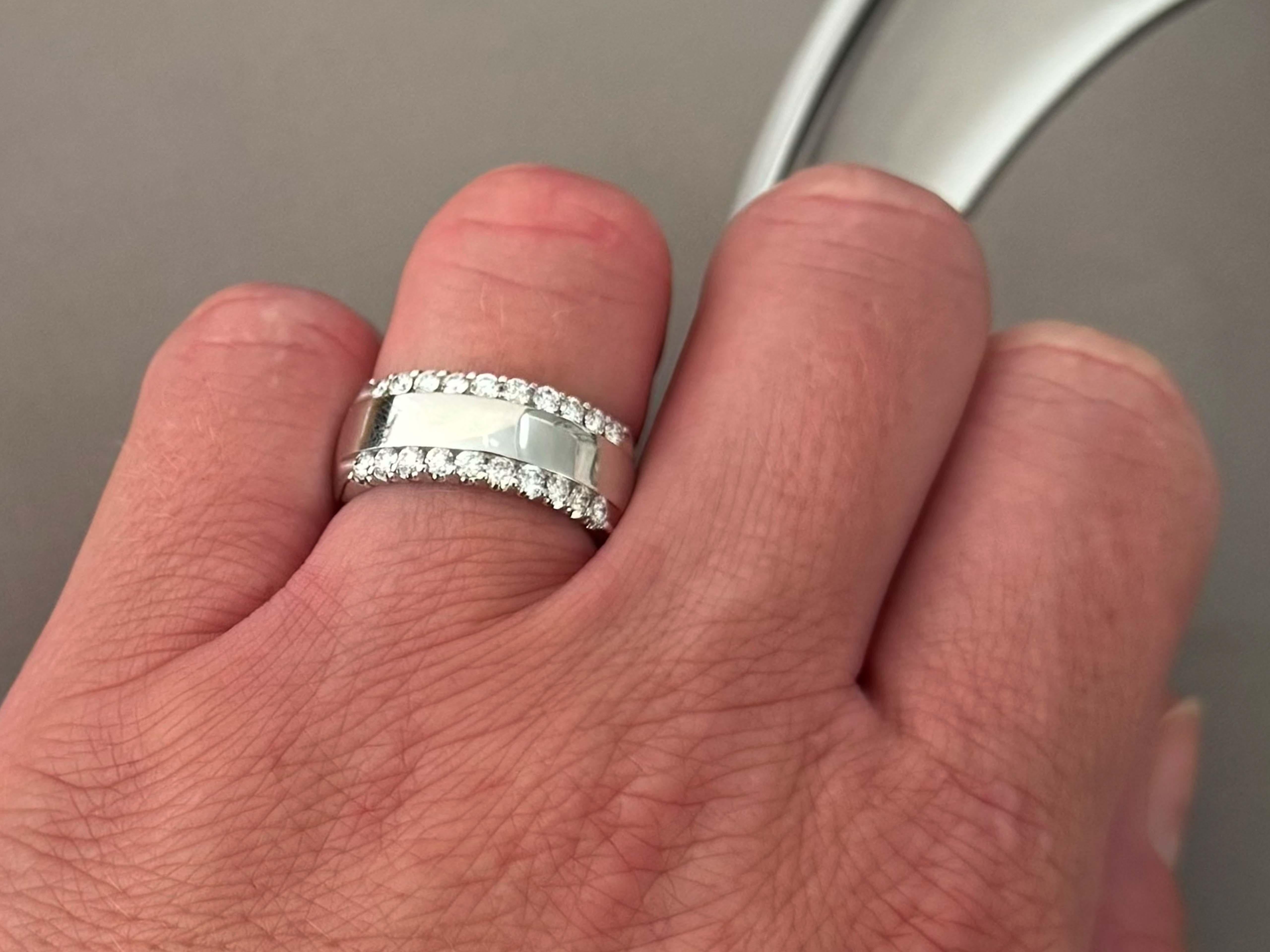 Item Specifications:

Metal: 14k White Gold

Diamond Count: 20 brilliant cut

Total Diamond Carat Weight: ~0.60 carats 

Diamond Color: F-G

Diamond Clarity: VS1-SI2

Ring Size: 7

Ring Height: 8 mm 

Total Weight: 8.3 Grams

Stamped: