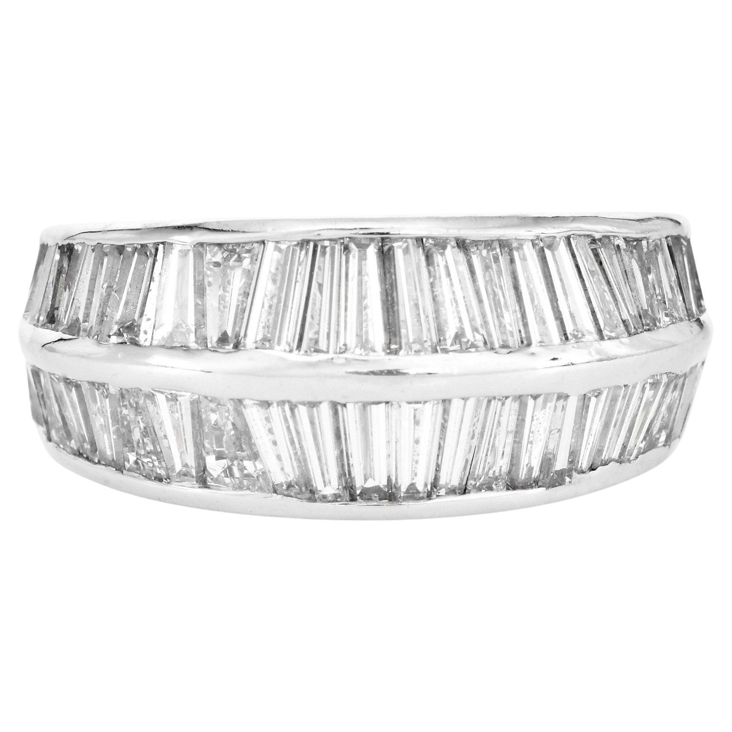 Elevate your style with this luxurious Estate Diamond Platinum knife-edged baguette Eternity Ring, a symbol of endless elegance.

Expertly crafted with intricate craftsmanship, this custom-built eternity band features 71 natural tapered baguette