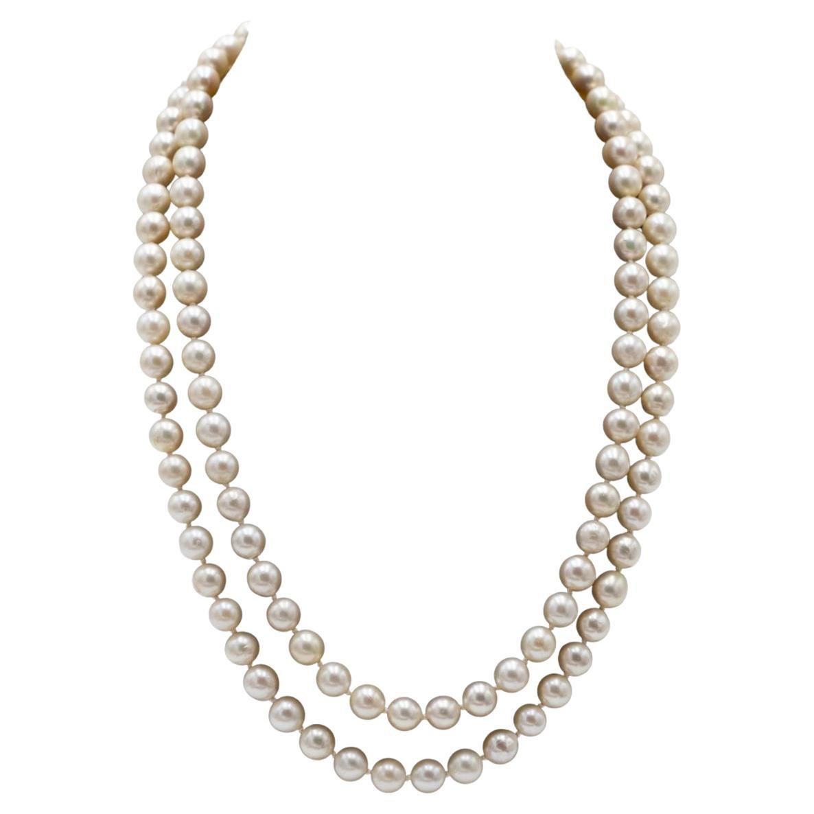 Double row cultured pearl necklace with gold clasp with diamonds and synthetic s