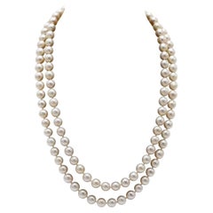 Double row cultured pearl necklace with gold clasp with diamonds and synthetic s