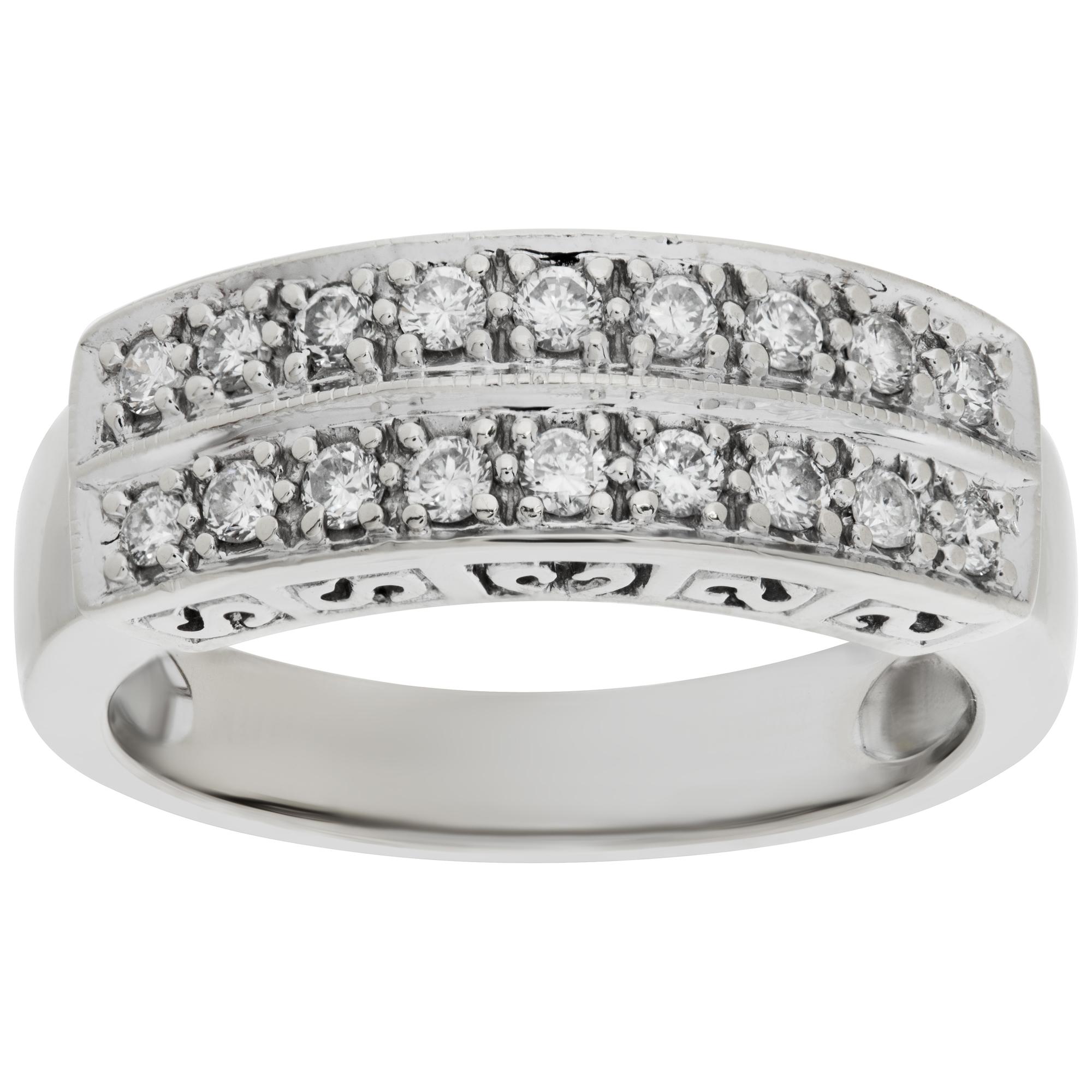 Double row diamond band in 14k white gold with approximately 0.35 carat in round diamonds; size 7.This Diamond ring is currently size 7 and some items can be sized up or down, please ask! It weighs 3.5 pennyweights and is 14k White Gold.
