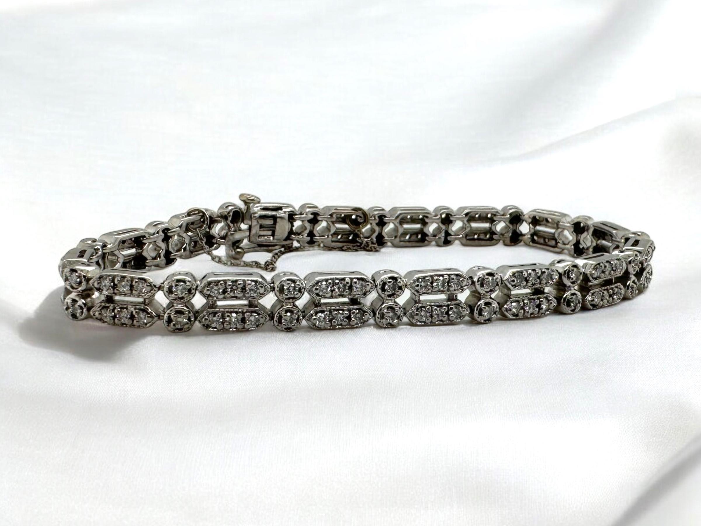 This is a beautiful spin on a classic tennis bracelet!

Bracelet Details
Material: 14K White Gold
Width: 6.5mm
Weight: 22.7 Grams
Length: 7 1/4 Inches

Accented by the following diamonds
128 - 1.5mm Round Brilliant Cut Diamonds; Estimated Combined
