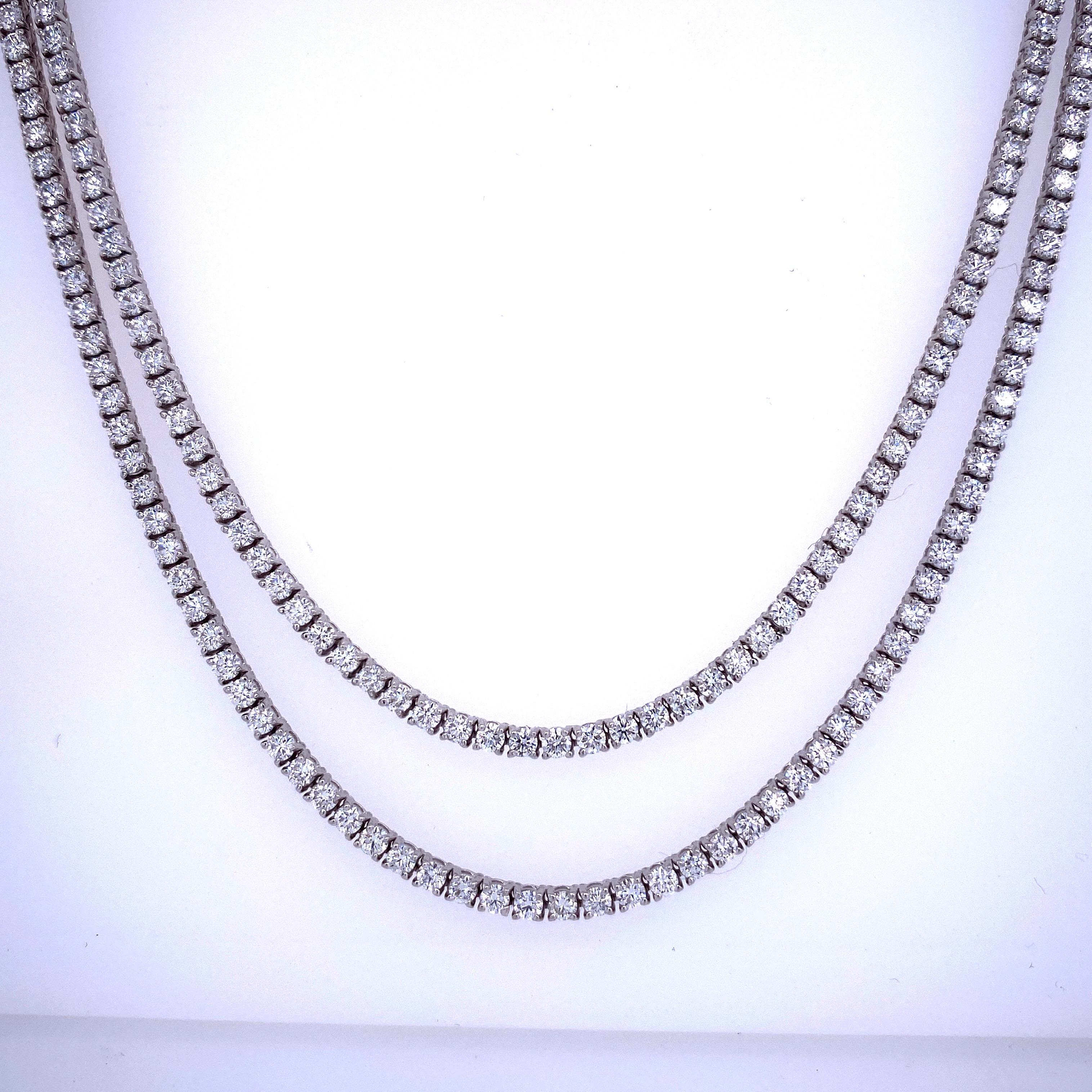 14K White Gold tennis necklace featuring a double diamond row of 215 round brilliants weighing 6.67 carats and high polished white gold beads in the back. 
Color G-H
Clarity SI2