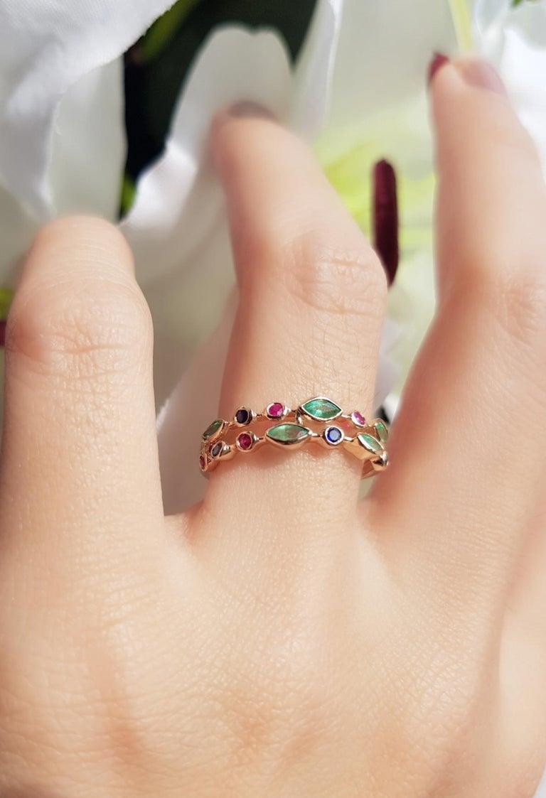 Two rows of emerald, ruby, and sapphire in a unique style. This ring is perfect for a woman who wants a classic design with a fashionable twist.

Ring Information
Metal: 18K Yellow Gold
Weight: 2.30 g. (approx. total weight)

Gemstones I
Type: