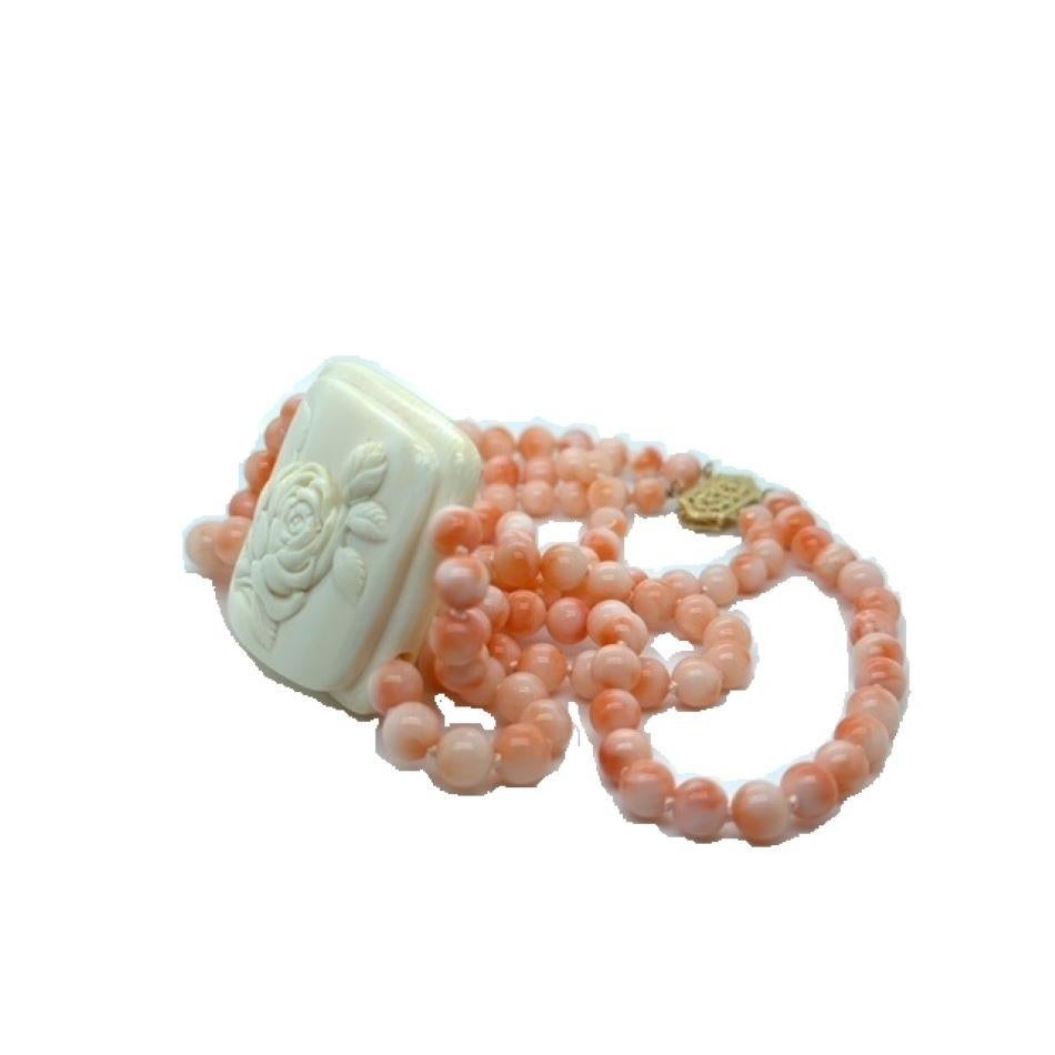  A magnificent signed ivory Netsuke of a peony, highly collectible, by famed ivory carver Shozan/Matsuyam in the late 19th Century- Meiji period, on a 2-row necklace of extremely fine Japanese 6.5MM Momo pink/cream coral beads. The Meiji period was