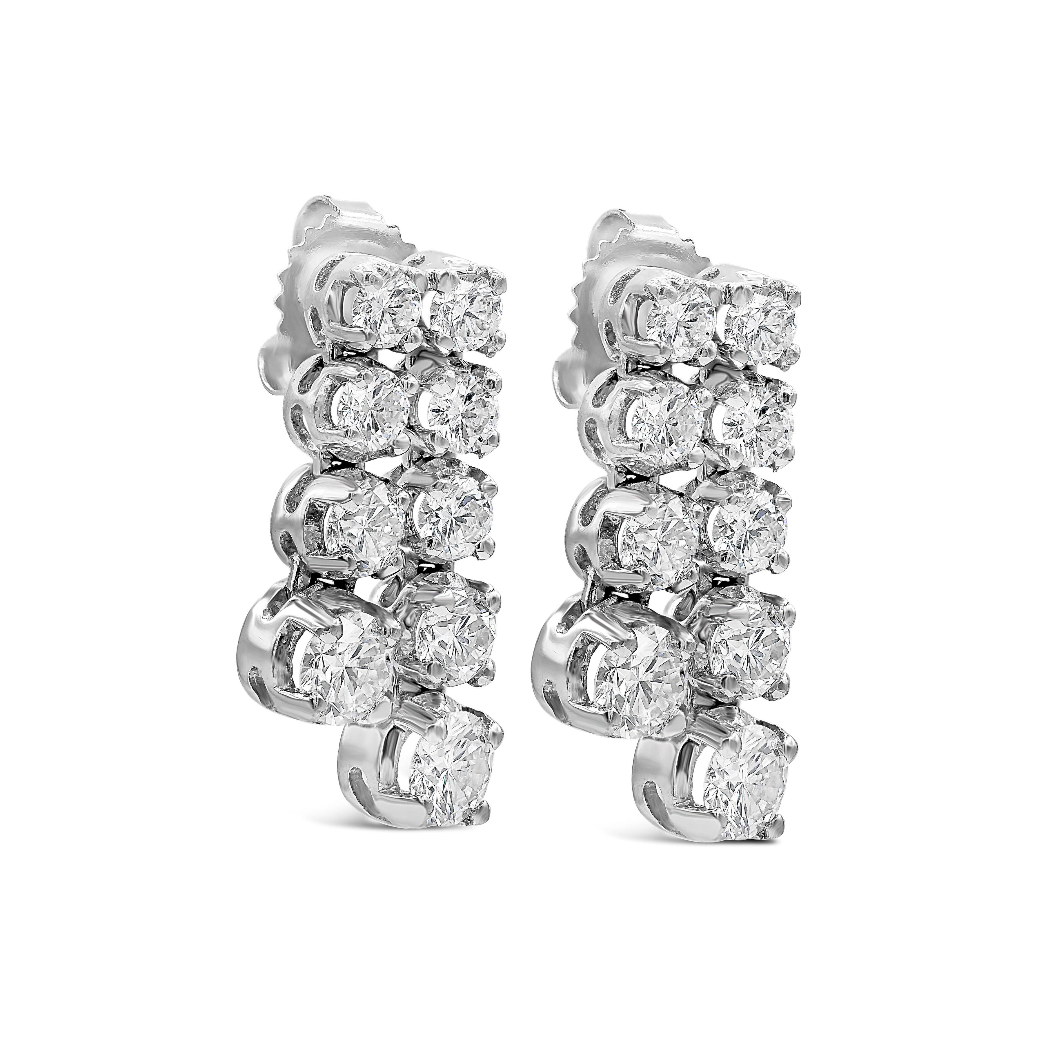 Each earring features two rows of round brilliant diamonds that gradually increases in size as it drops from the earrings. Set in 18 karat white gold. Diamonds weigh 3.83 carats total.

Style available in different price ranges. Prices are based on