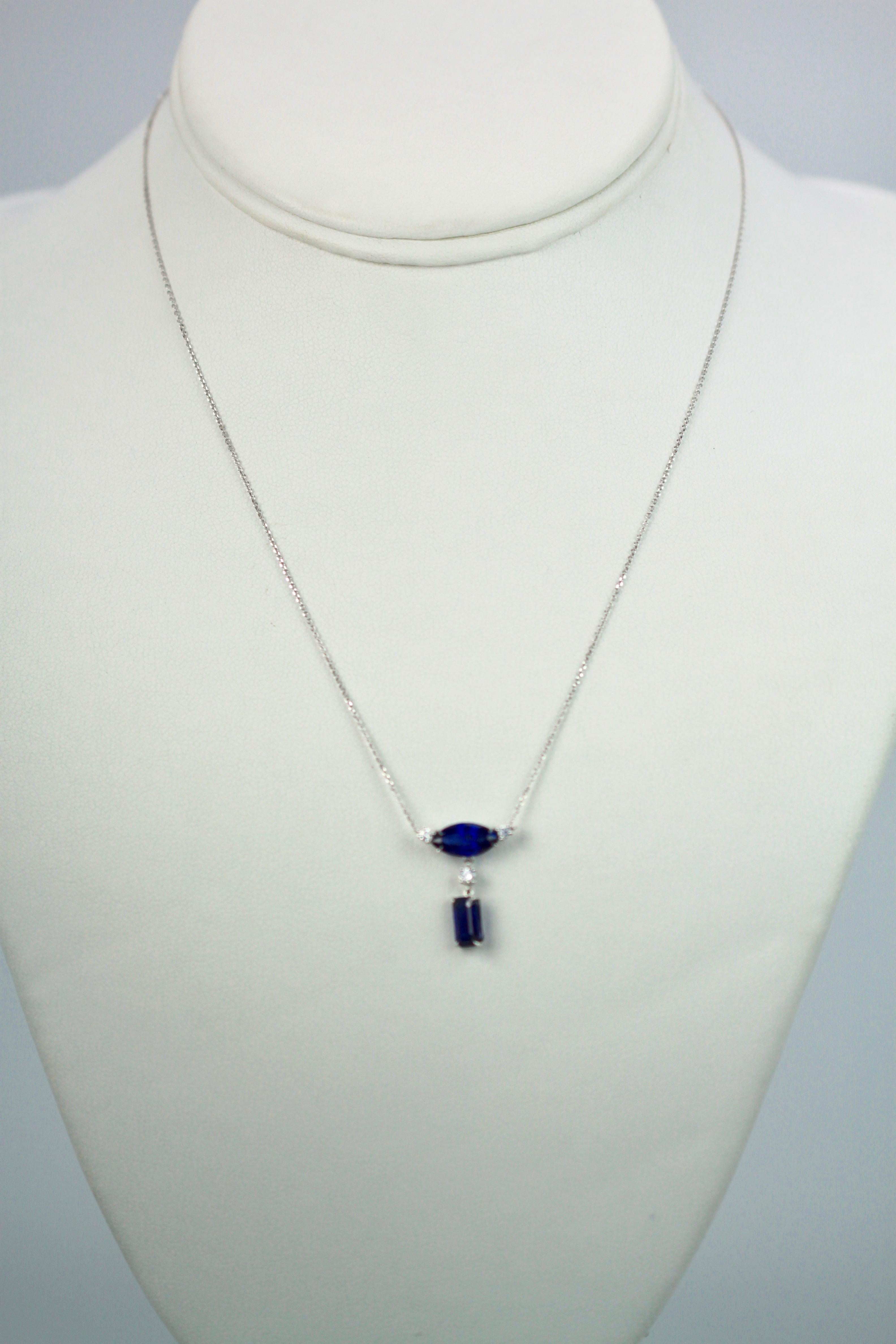 This Double Sapphire Diamond Necklace is small but packs a punch.  The Sapphires are gorgeous shade of deep blue on a white Gold Necklace marked 750.  One Sapphire is 1.00 Carat and the other is .80 points with 3 Diamonds, (2) at 0.05 carats and (1)