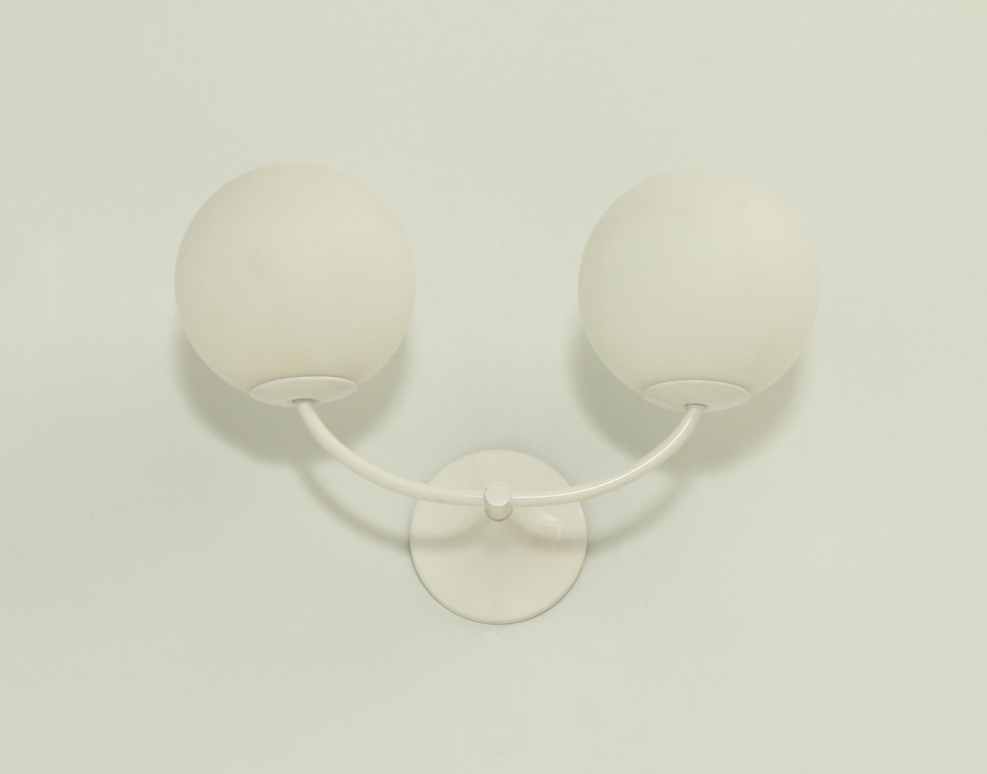 Double sconce designed by E. R. Nele for Temde Leuchten, Switzerland in 1970's. Lacquered metal, wood and white opaline glass globes.