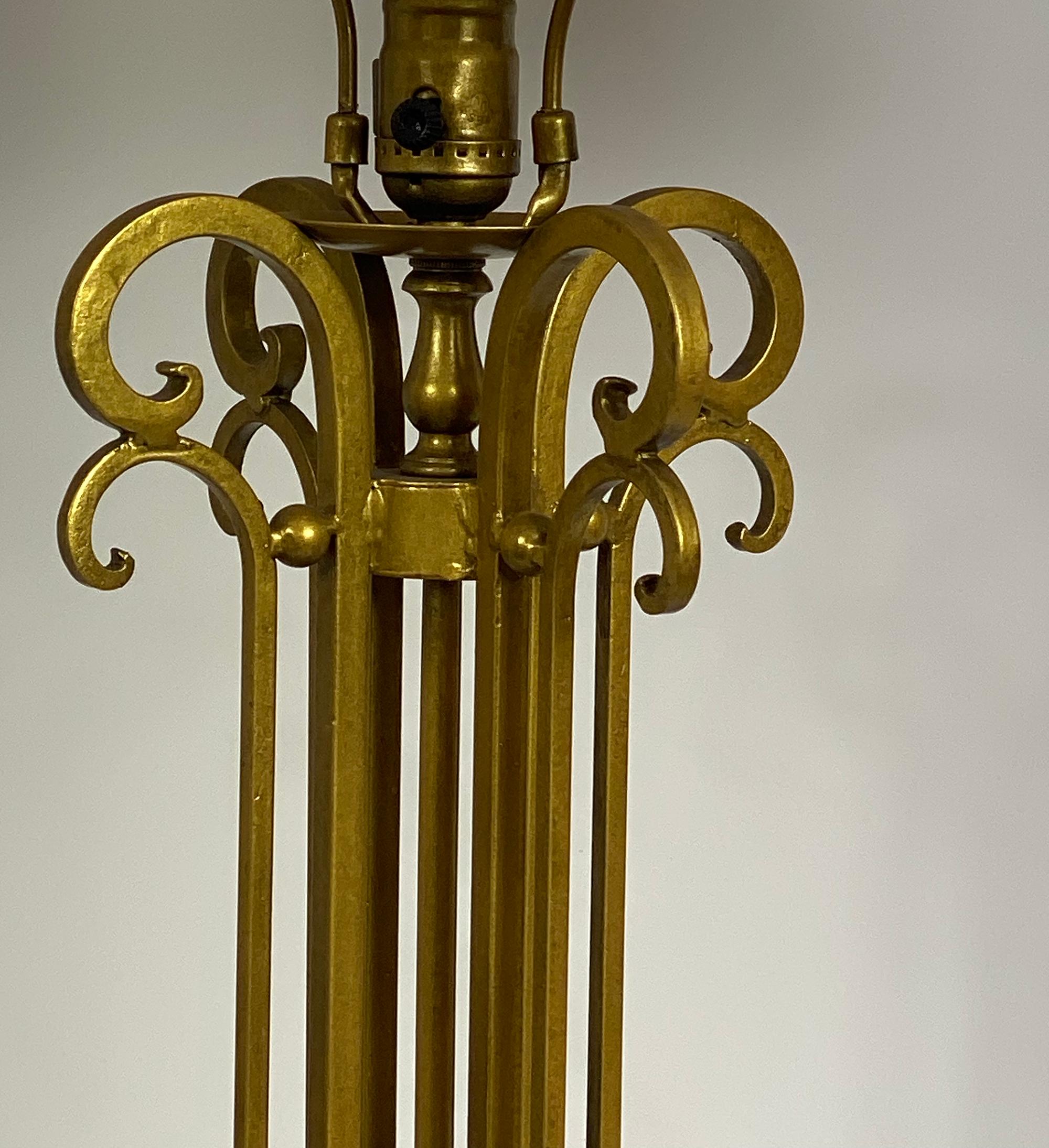 The Double Scroll Table Lamp has an interesting combination of styles. It incorporates Classic wrought iron scroll work and the elegance of England at the turn of the last Centruy. The Antique Gold finish completes the ensemble.  It is completely