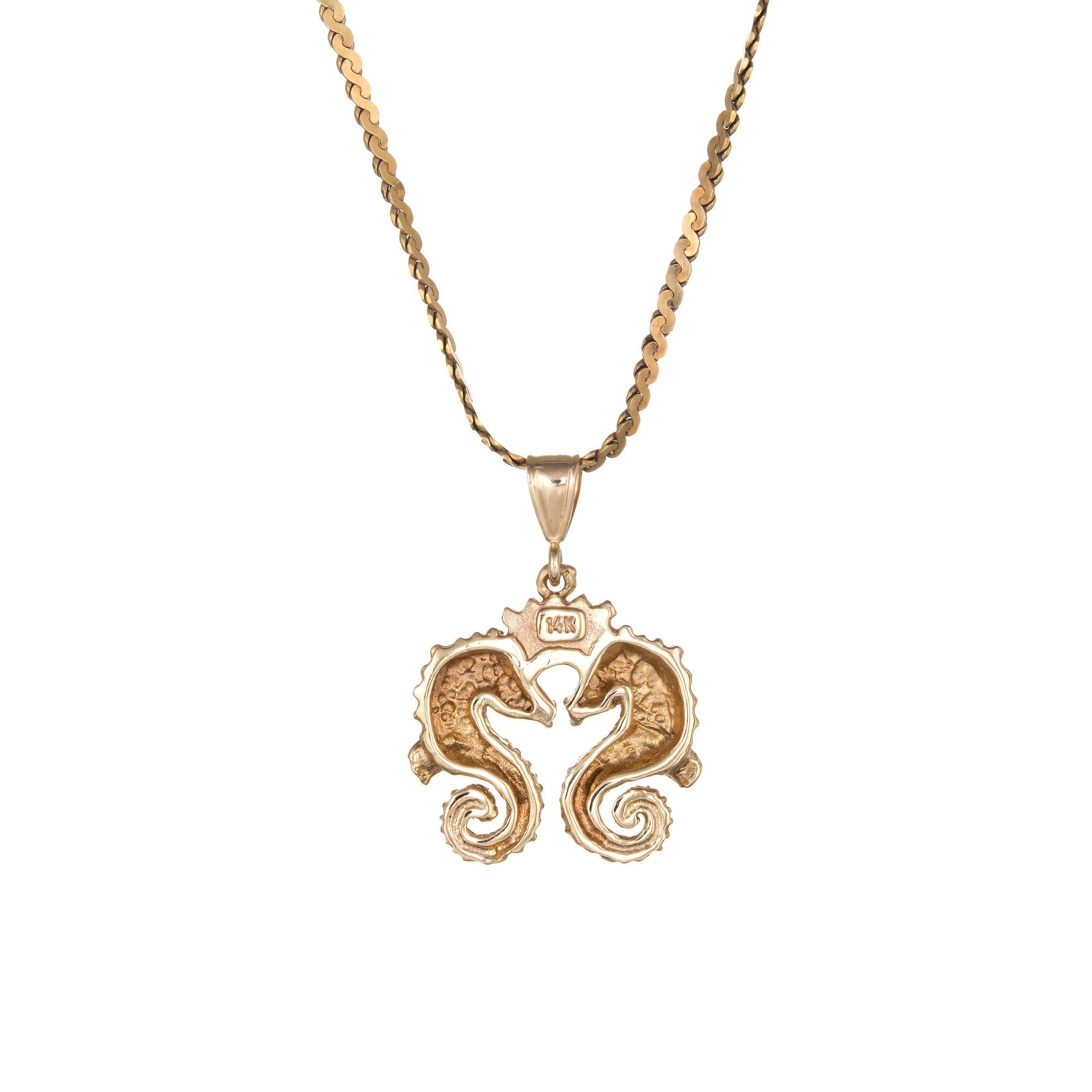 Charming seahorse pendant & necklace crafted in 14 karat yellow gold.  

The pendant comes with a fine link 14k yellow chain that measures 18 inches in length. The two seahorses join together in an embrace. 

The pendant & necklace is in excellent