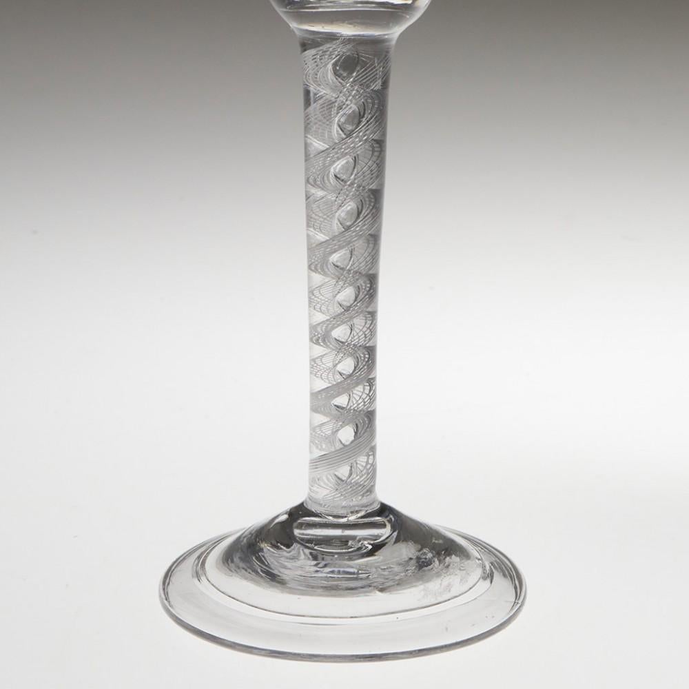 Heading : Double Series Air Twist Stem Georgian Wine Glass c1745
Period : George II - c1745
Origin : England
Colour : Clear
Bowl : Round funnel
Stem : A pair of multi-ply corkscrews outside a pair of corkscrew threads
Foot : Folded conical
Pontil :