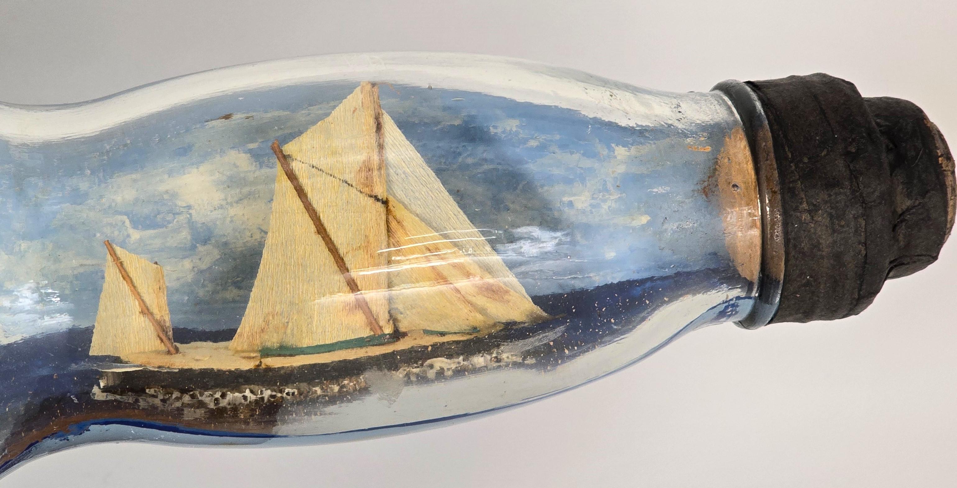 Folk Art Double ship in a whiskey bottle, diorama, folk art design circa 1920 For Sale