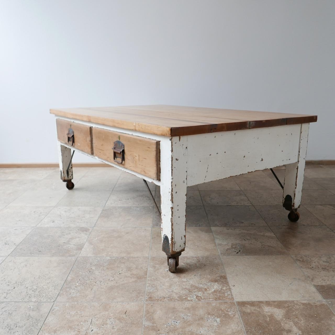 A large bakers prep table, ideal as a kitchen centre table.

England, circa 1930s.

Two drawers to each side.

Solid sycamore top, two repairs to the top with inlaid wood.

Original paint finish, so patina commensurate with age.

Braced