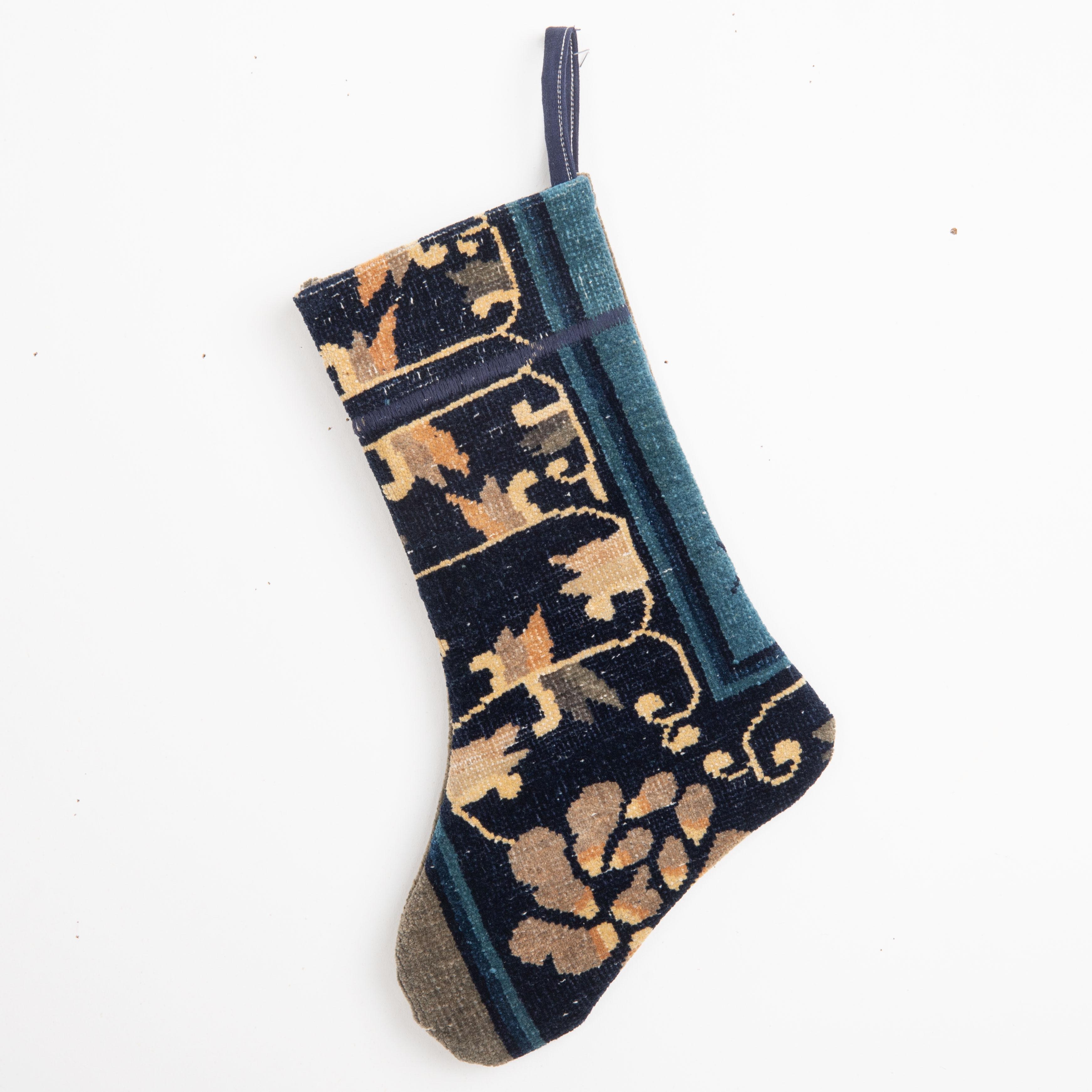This Christmas Stocking was made from a late 19th or Early 20th C. Chinese rug fragments.

Please note, this stocking was made from Chinese rug fragments.


