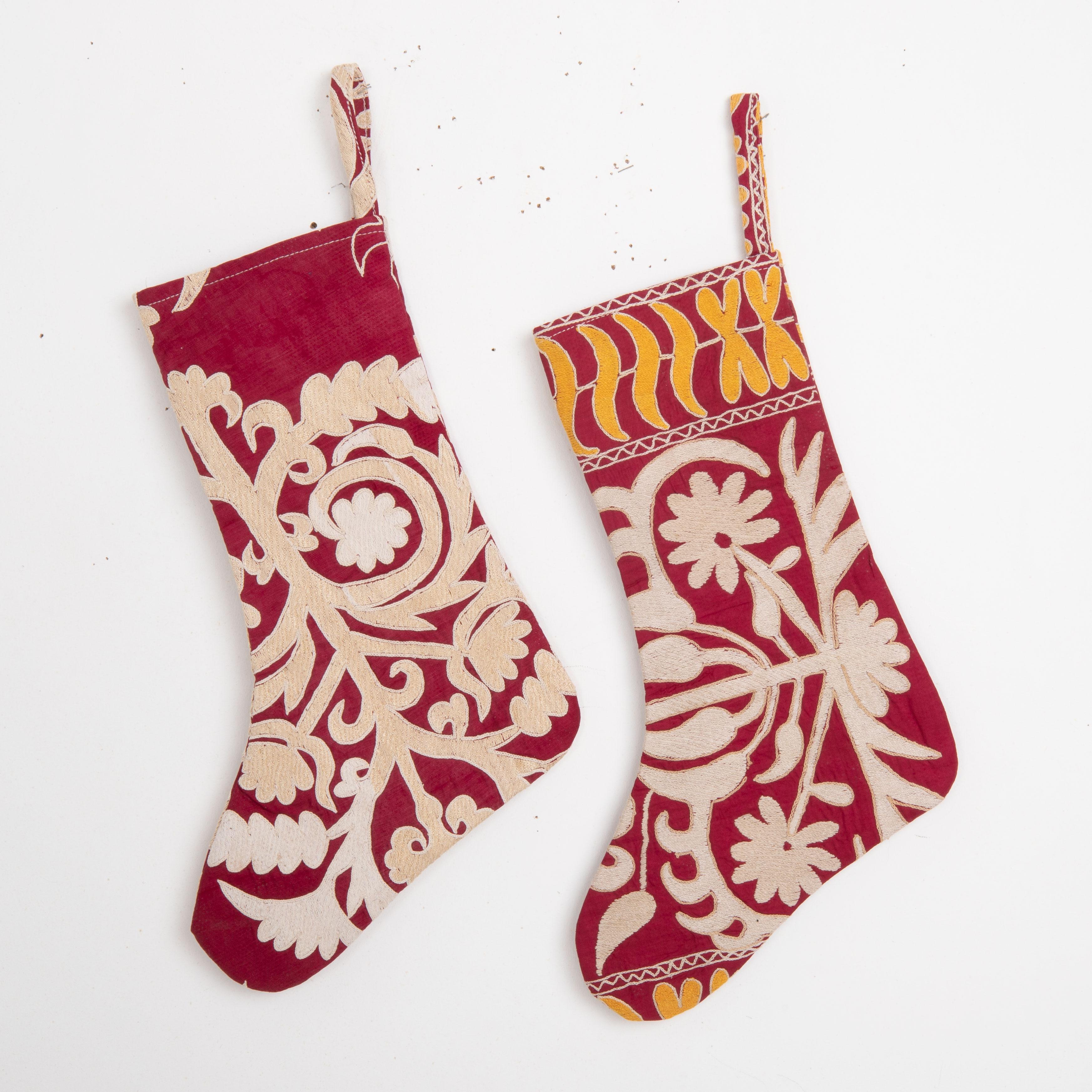 
These Christmas Stockings were made from mid 20th C. Uzbek Suzani Fragments.

Please note these were made from vintage suzani fragments.
