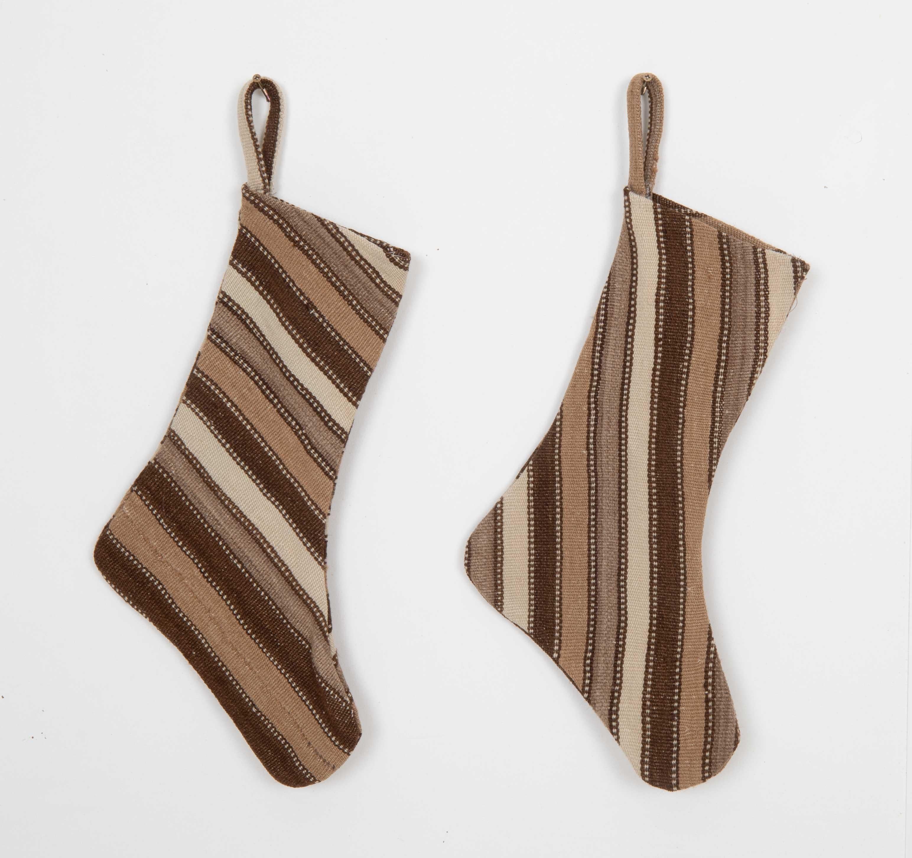 These Christmas Stockings were made from mid 20th C. Anatolian Kilim Fragments.


Please note, this stocking was made from kilim fragments
