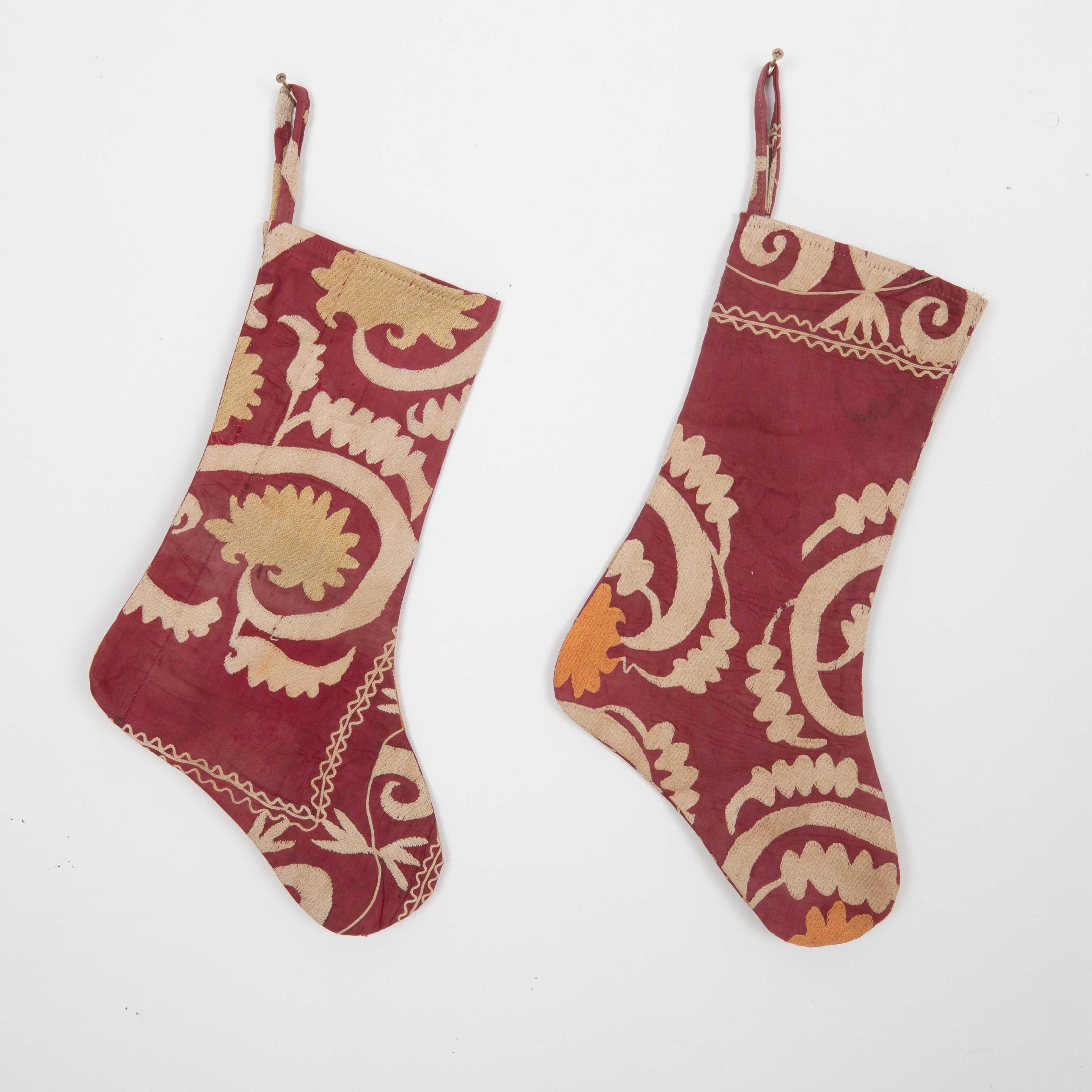 These Christmas Stockings were made from mid 20th C. Uzbek Suzani Fragments.

Please note these were made from vintage suzani fragments.
