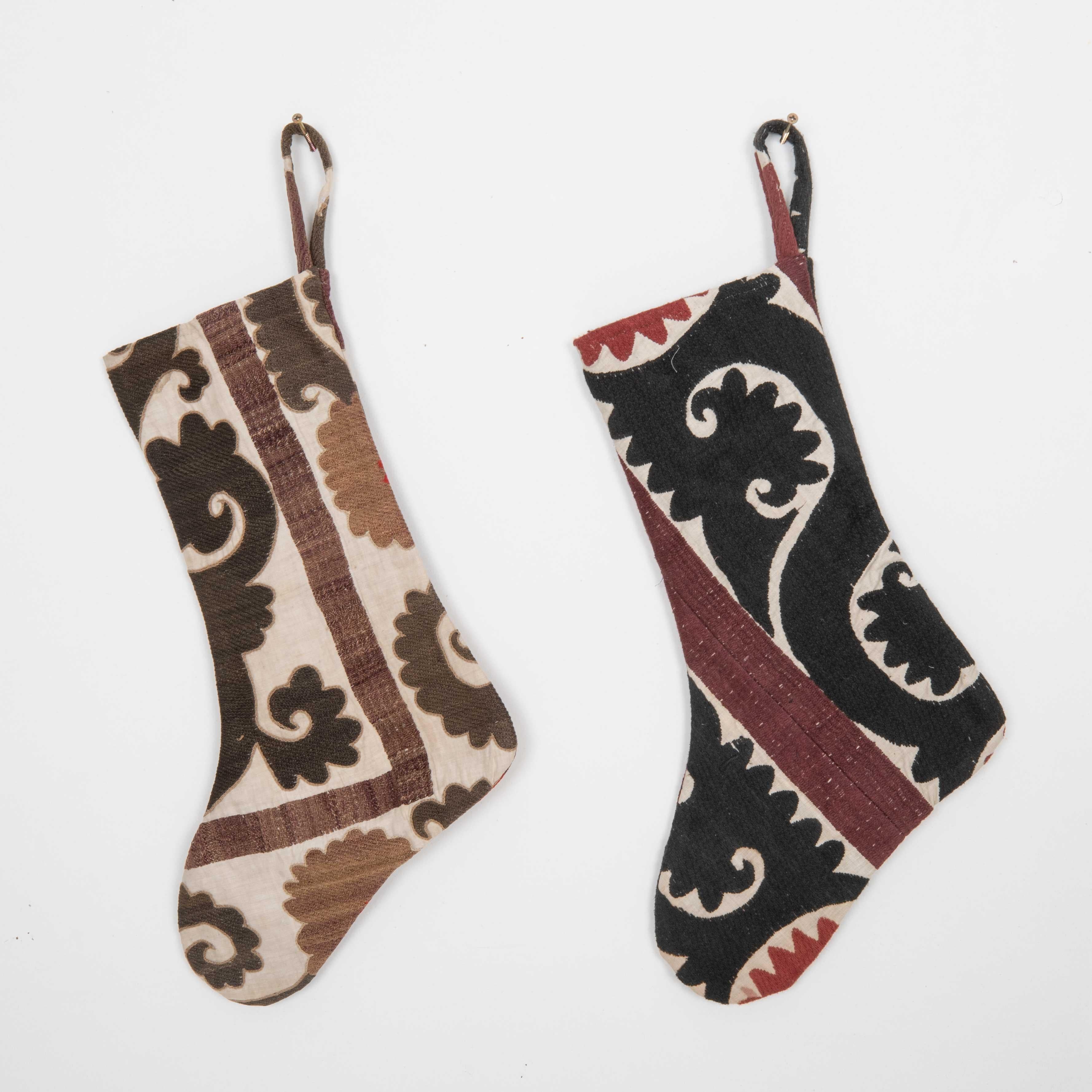 These Christmas Stockings were made from mid 20th C. Uzbek Suzani Fragments.

Please note these were made from vintage suzani fragments.
