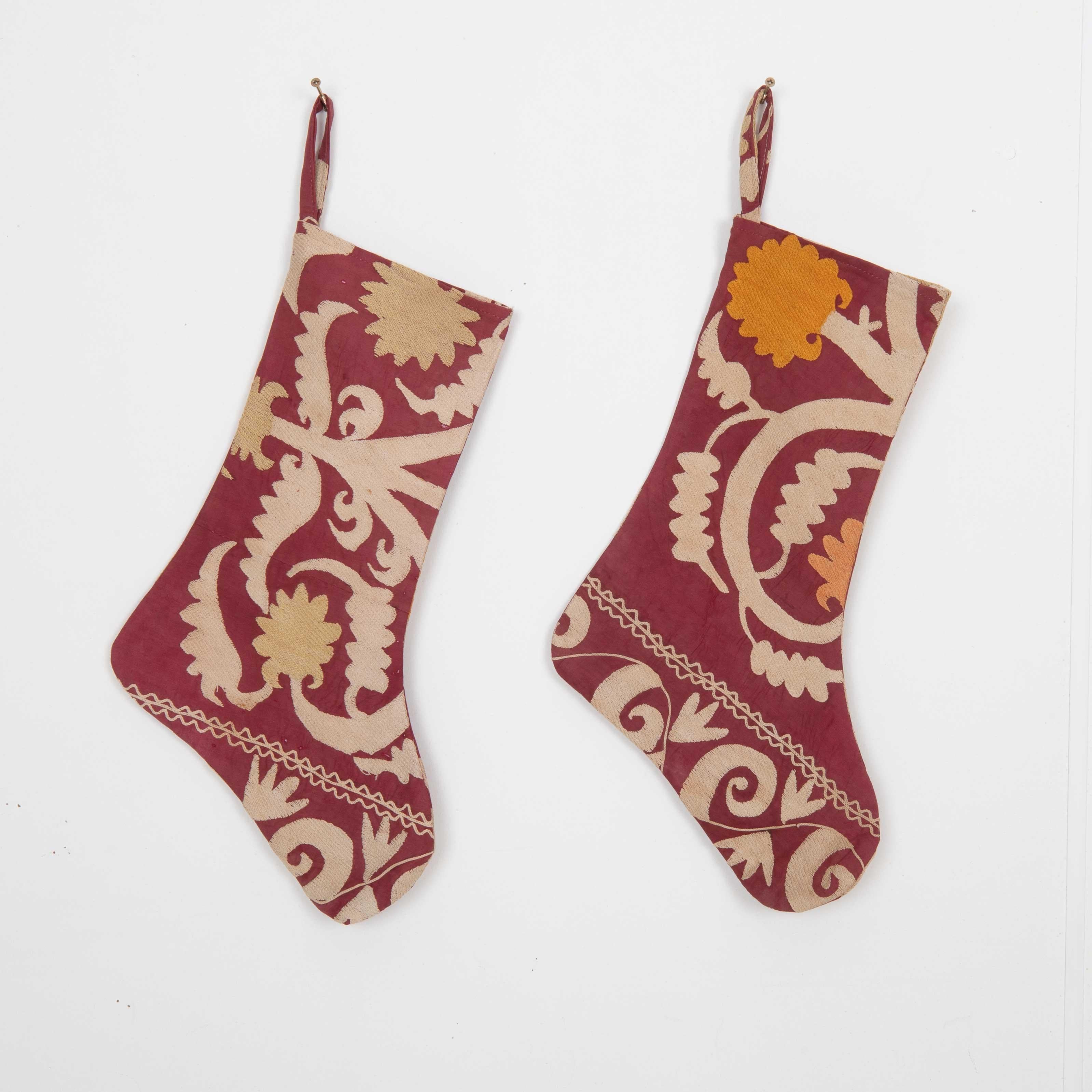 These Christmas Stockings were made from mid 20th C. Uzbek Suzani Fragments.

Please note these were made from vintage suzani fragments.
